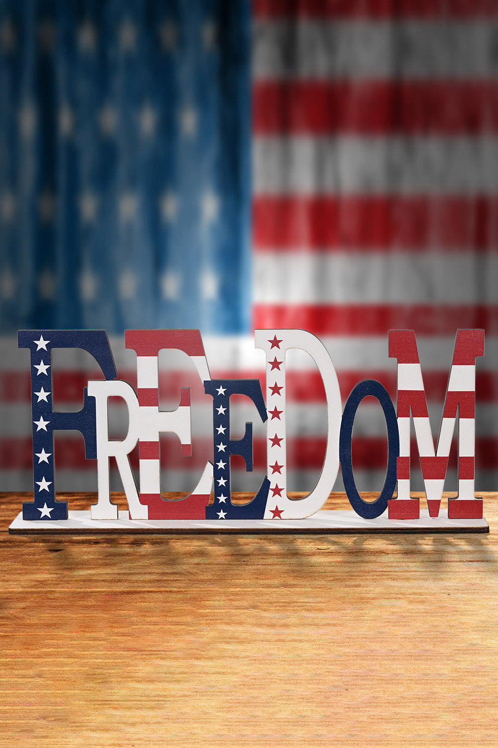 A vibrant set of 7-piece Independence Day letter decor ornaments made from knit fabric, showcasing red, white, and blue colors.