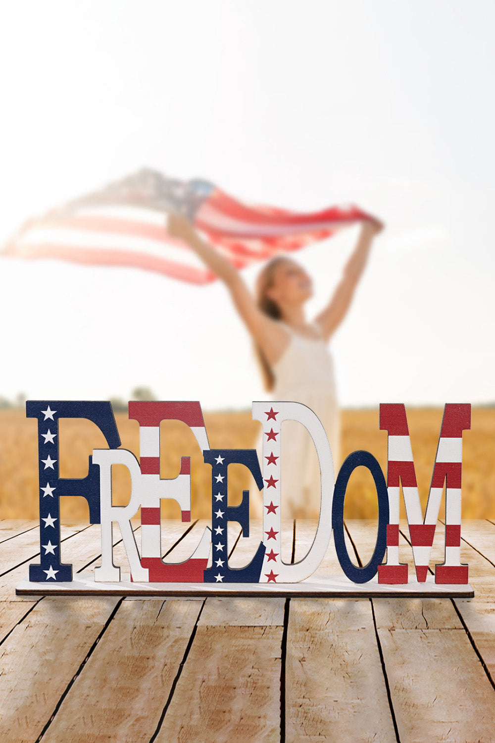 A vibrant set of 7-piece Independence Day letter decor ornaments made from knit fabric, showcasing red, white, and blue colors.