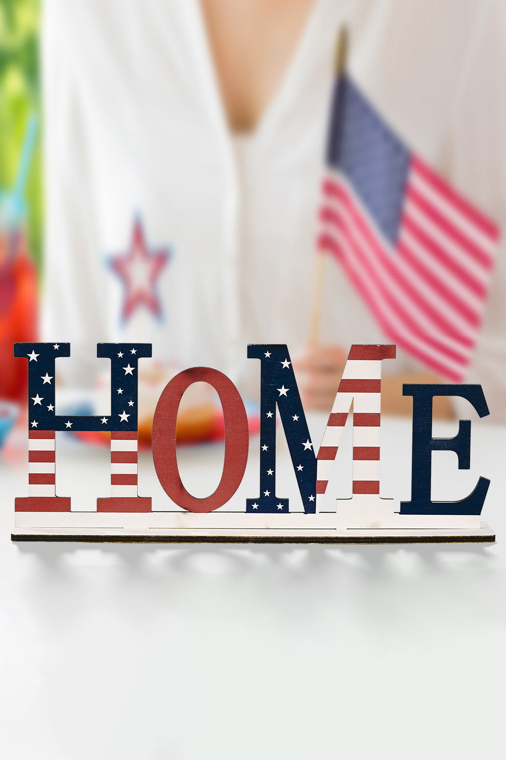 A vibrant set of 7-piece Independence Day letter decor ornaments made from knit fabric, showcasing red, white, and blue colors.