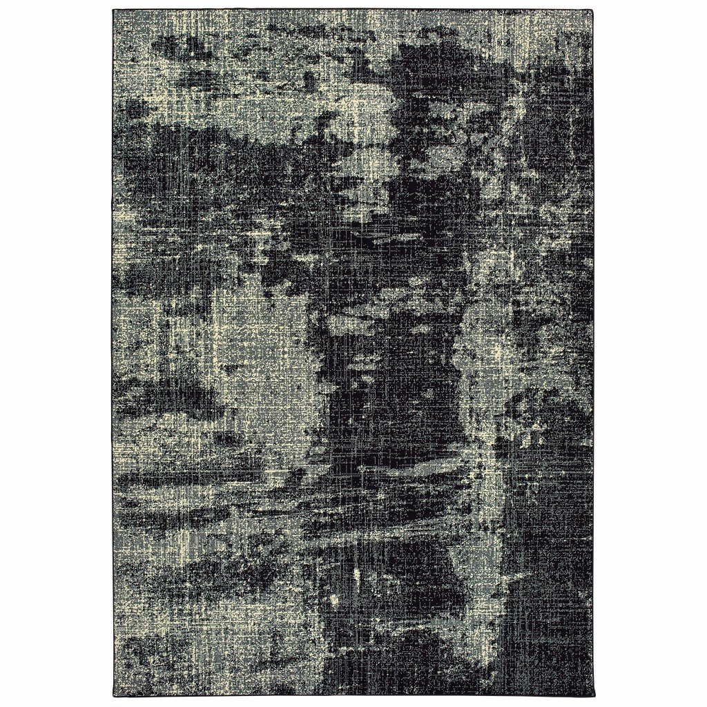 A modern 9x12 black and ivory abstract area rug, showcasing a distressed pattern, perfect for indoor use.