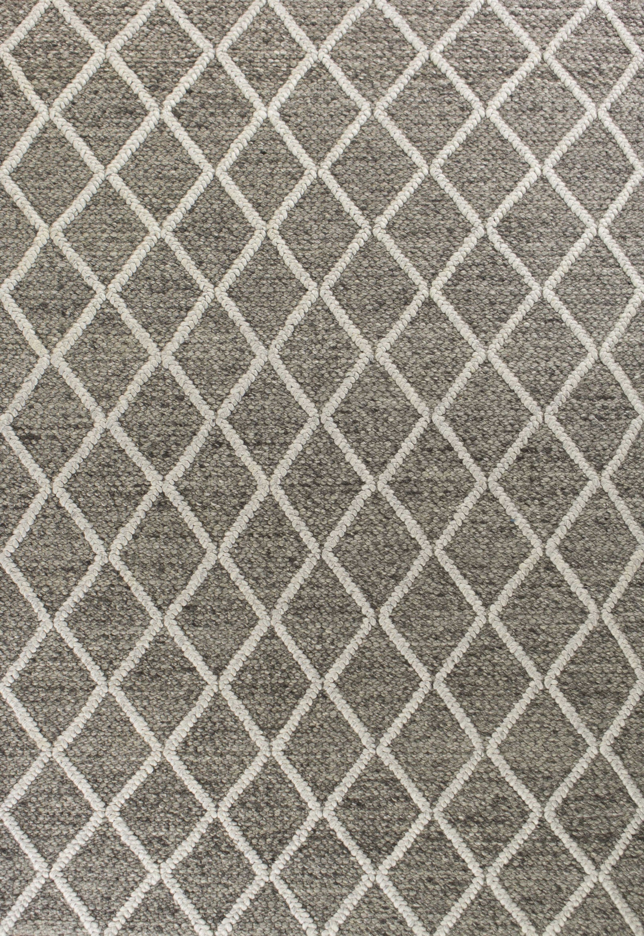 A luxurious 9x13 dark grey wool area rug featuring a diamond pattern, perfect for enhancing modern home decor.