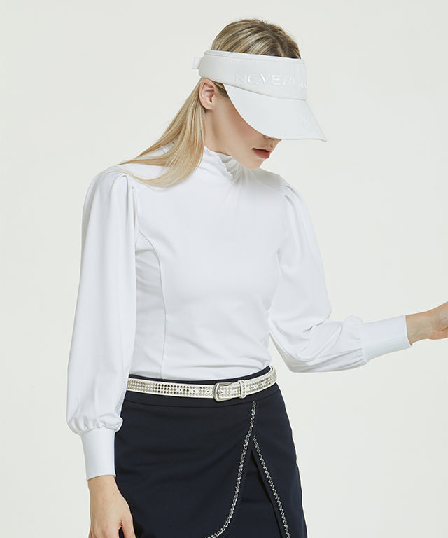 Abel Golgi Half Turtle in Off White featuring luxurious ribbed fabric and feminine puff shoulders, perfect for stylish layering.