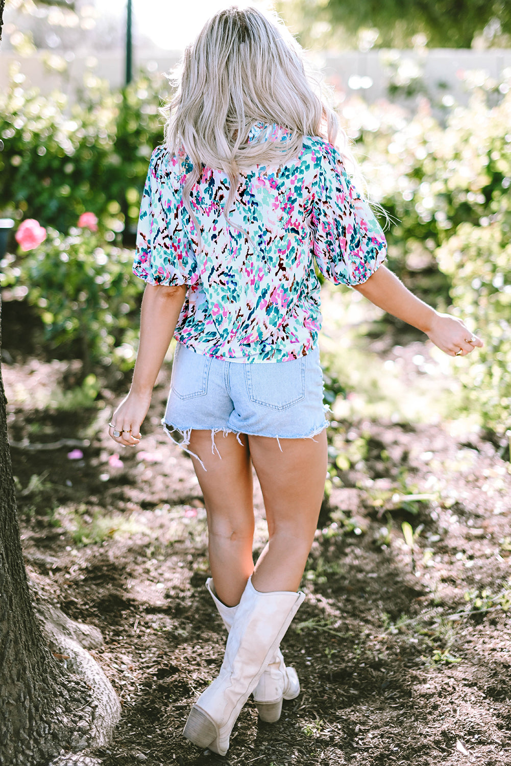 Abstract Print Puff Sleeve Mock Neck Blouse featuring a modern silhouette and chic design with puff sleeves.