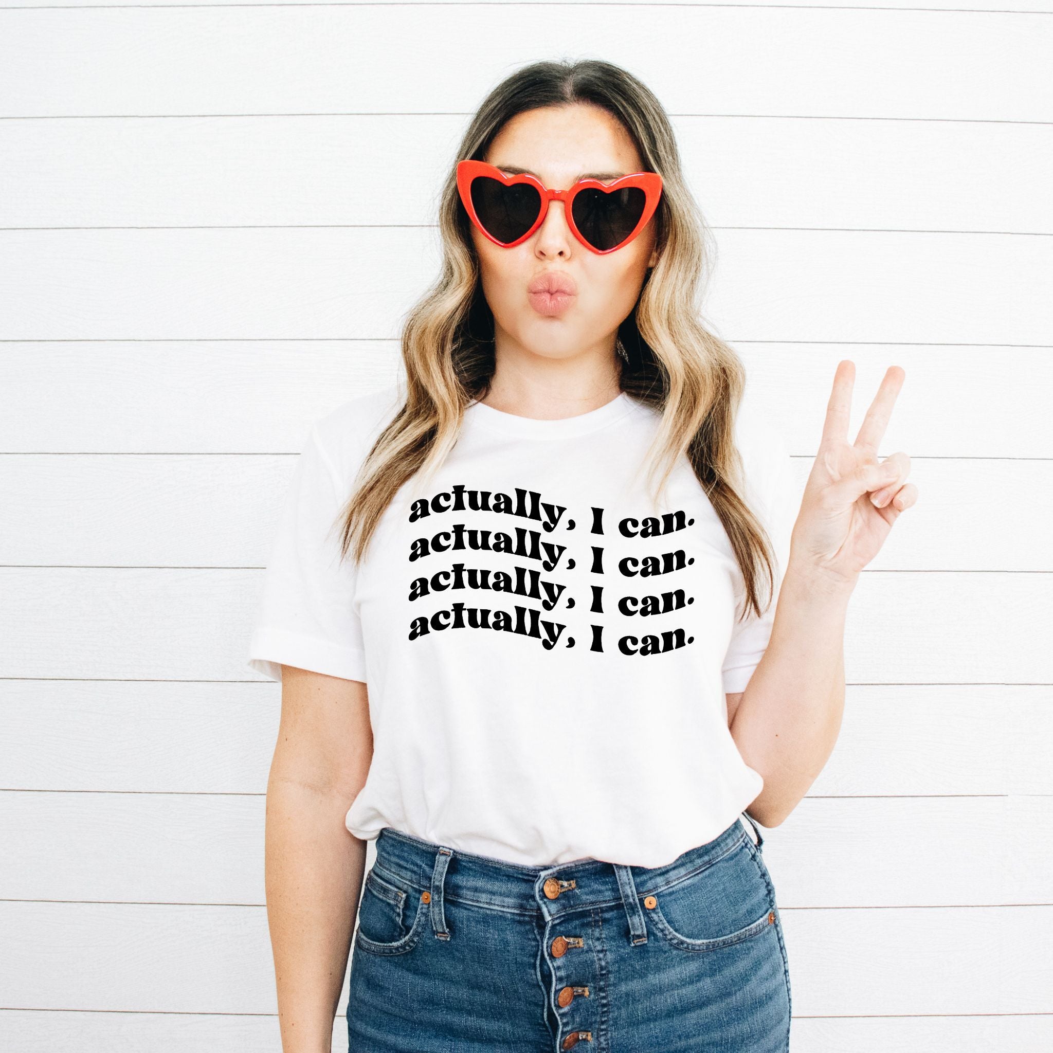 A comfortable unisex Actually I Can Tee made from 100% cotton, featuring a motivational phrase in bold print.