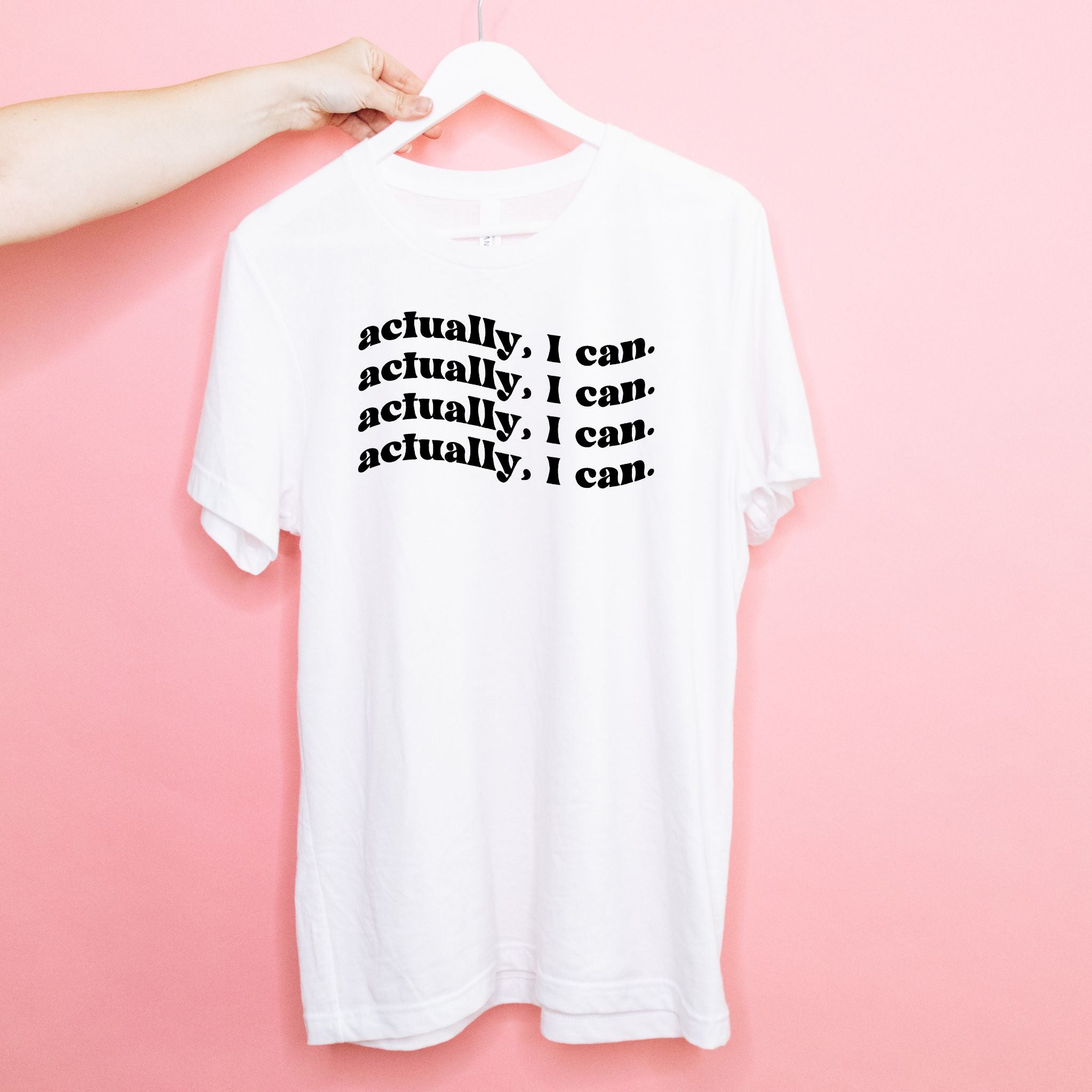 A comfortable unisex Actually I Can Tee made from 100% cotton, featuring a motivational phrase in bold print.