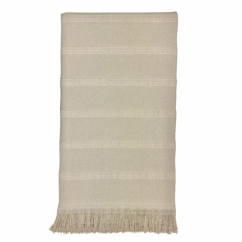 Aegean Turkish Towel featuring subtle stripes, terry backing, and eyelash fringe, showcasing its vibrant colors and craftsmanship.