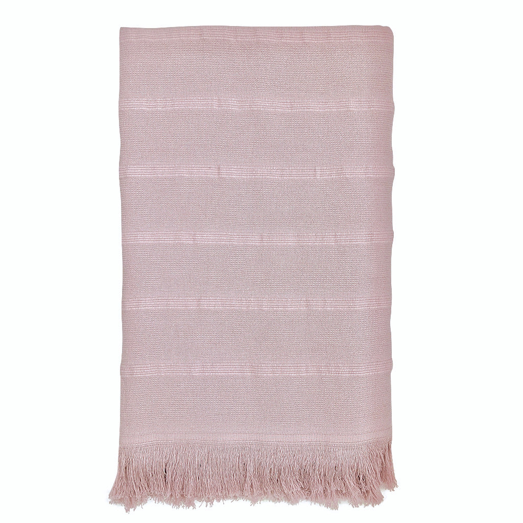 Aegean Turkish Towel featuring subtle stripes, terry backing, and eyelash fringe, showcasing its vibrant colors and craftsmanship.