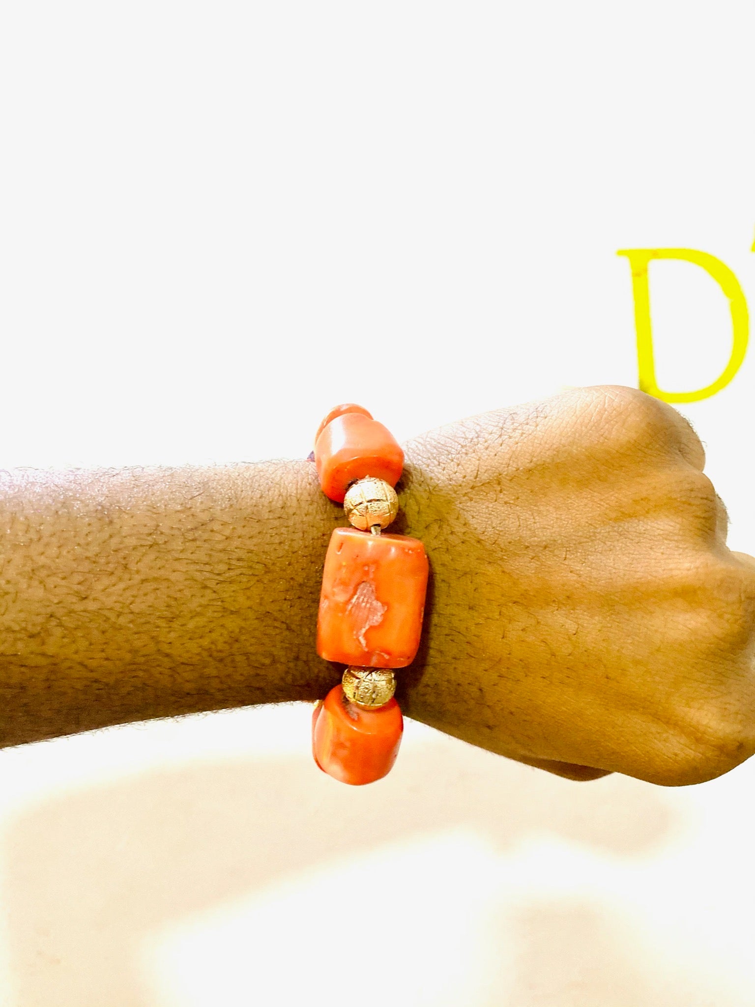 A beautifully handcrafted African Coral Bracelet featuring antique coral gemstones, showcasing vibrant colors and intricate designs.