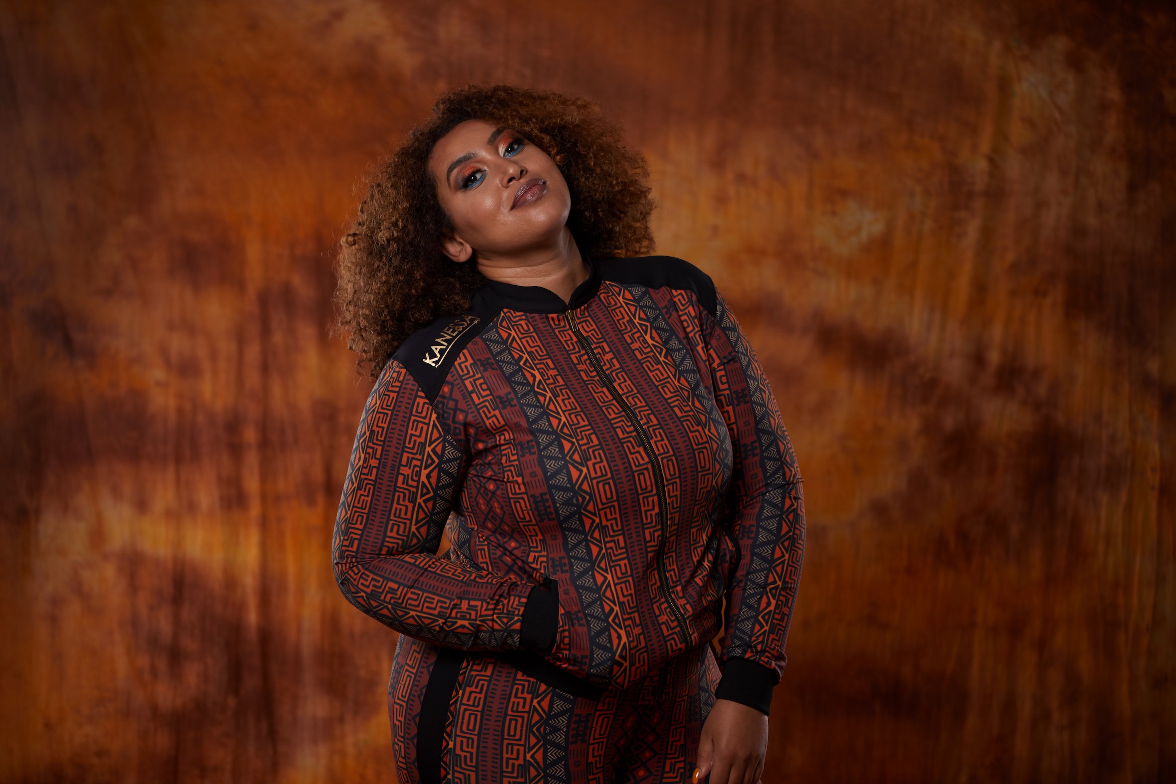 A stylish African Jacket designed for plus-size women, featuring vibrant prints and a flattering fit, perfect for workouts and casual outings.