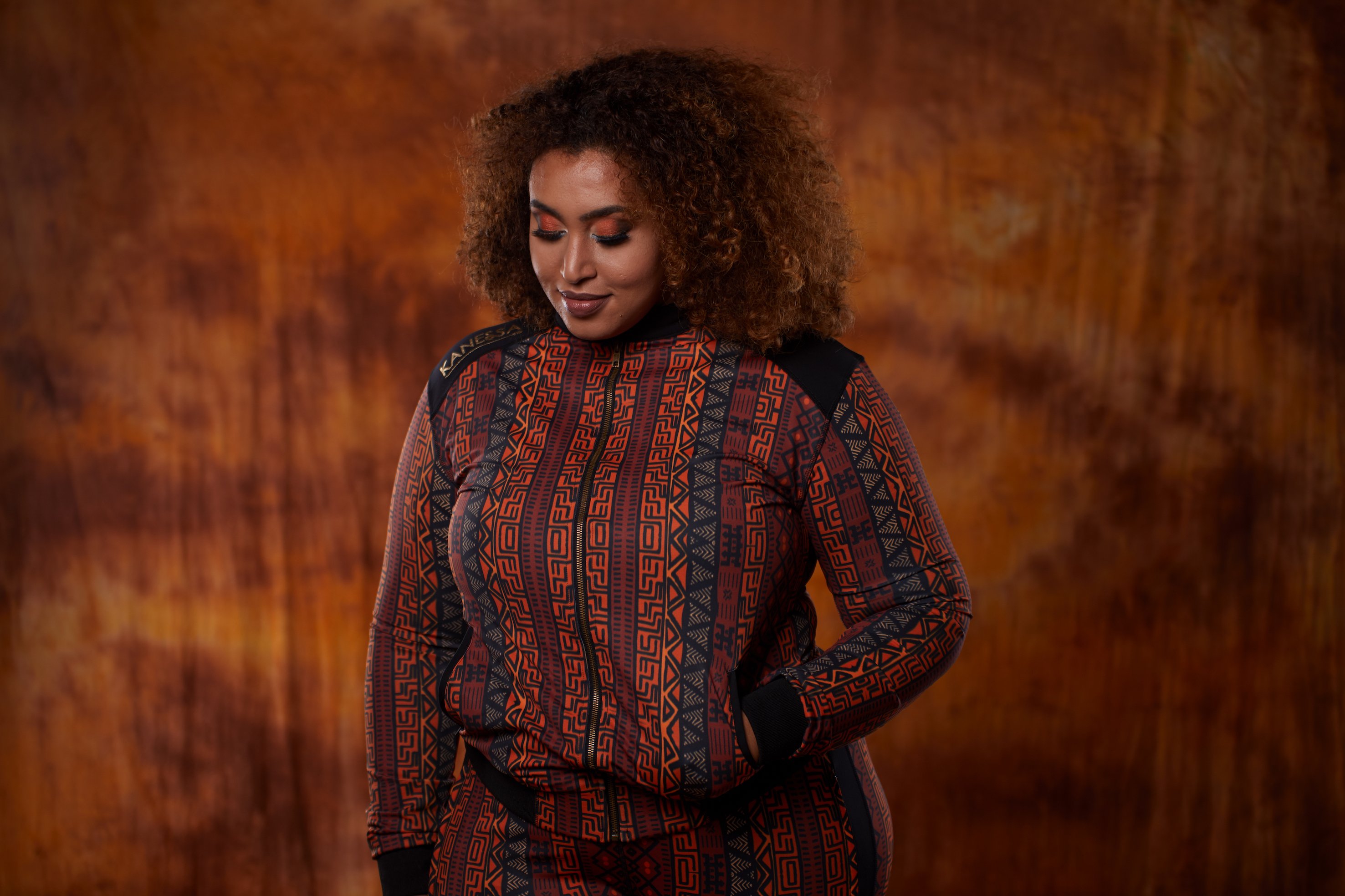 A stylish African Jacket designed for plus-size women, featuring vibrant prints and a flattering fit, perfect for workouts and casual outings.