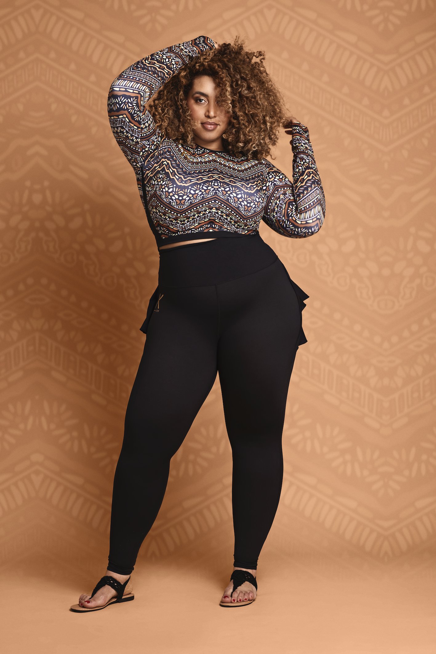 Afriq Crop Top featuring an elegant African pattern, long sleeves, and a comfortable fit.