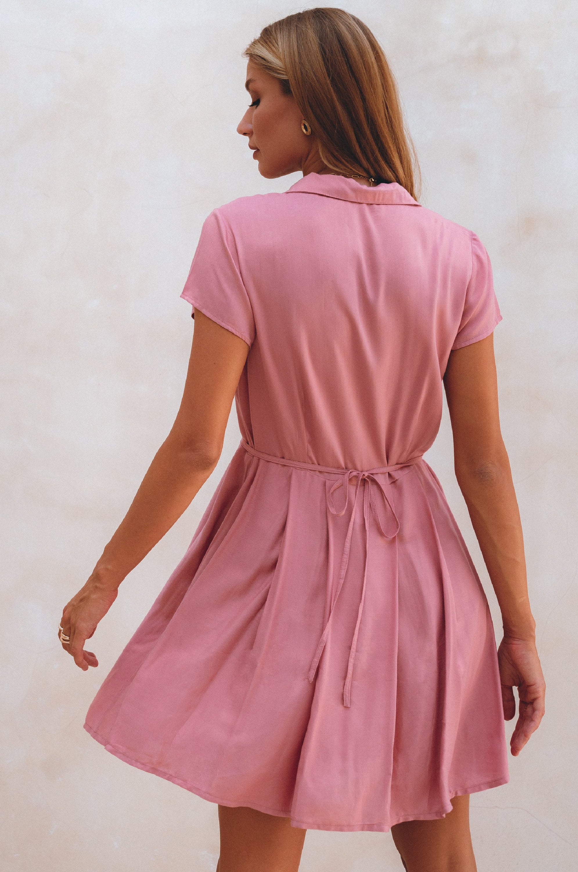 Agnes Shirt Dress featuring a button-down design, V-neckline, and self-tie waist in a breezy mini length.