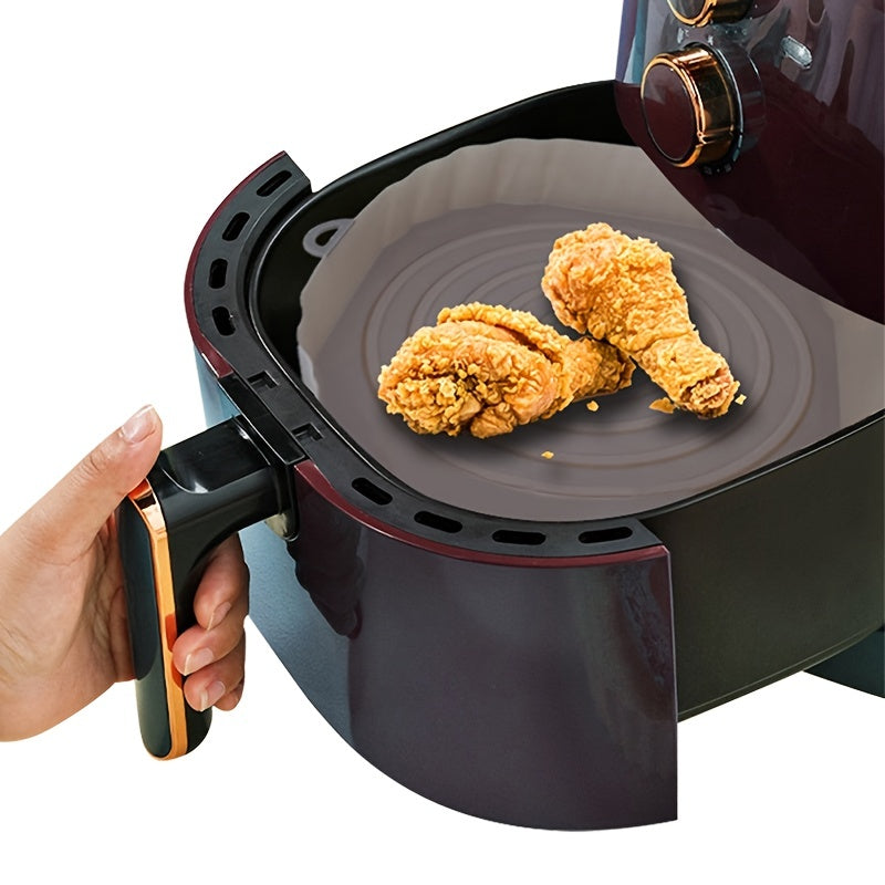 Air Fryer Usable Silicone Liner in oval shape, made of durable silicone material, designed for easy cooking and cleanup.