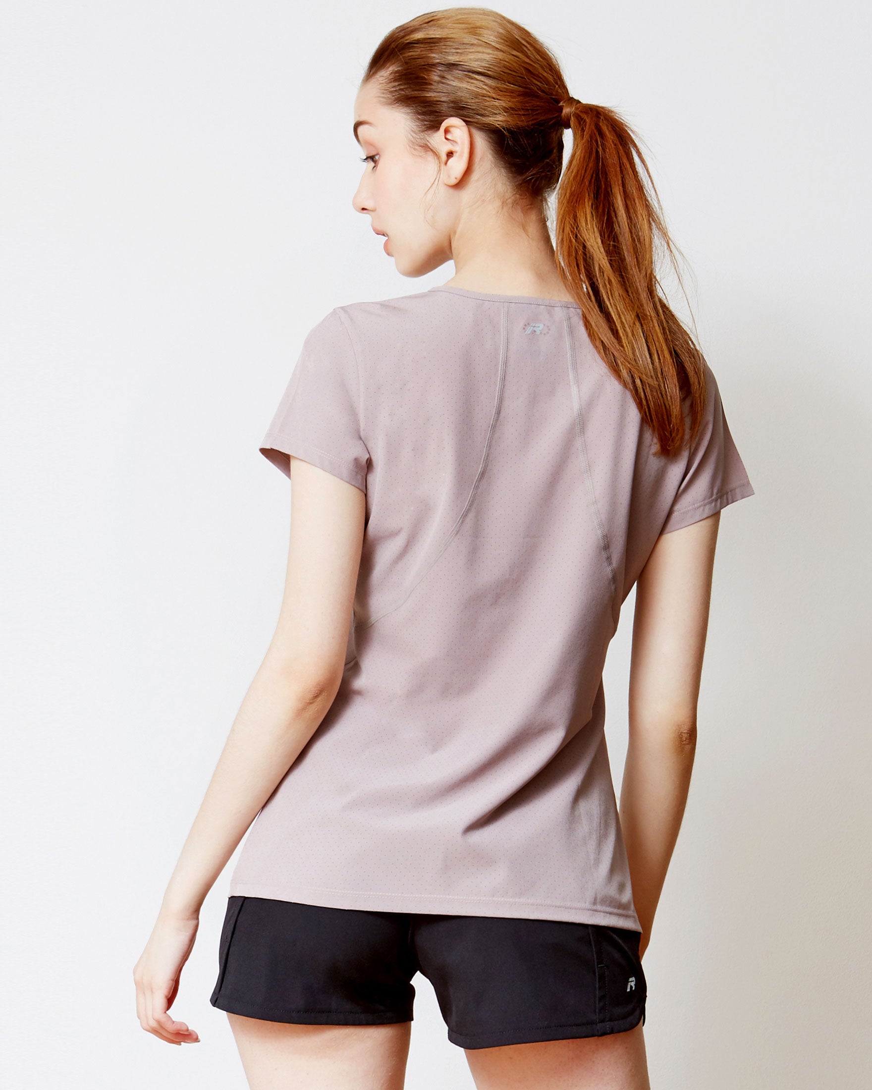 Airy Mile Laser Cut Mesh Top featuring breathable mesh design and short sleeves, ideal for workouts and hot weather.