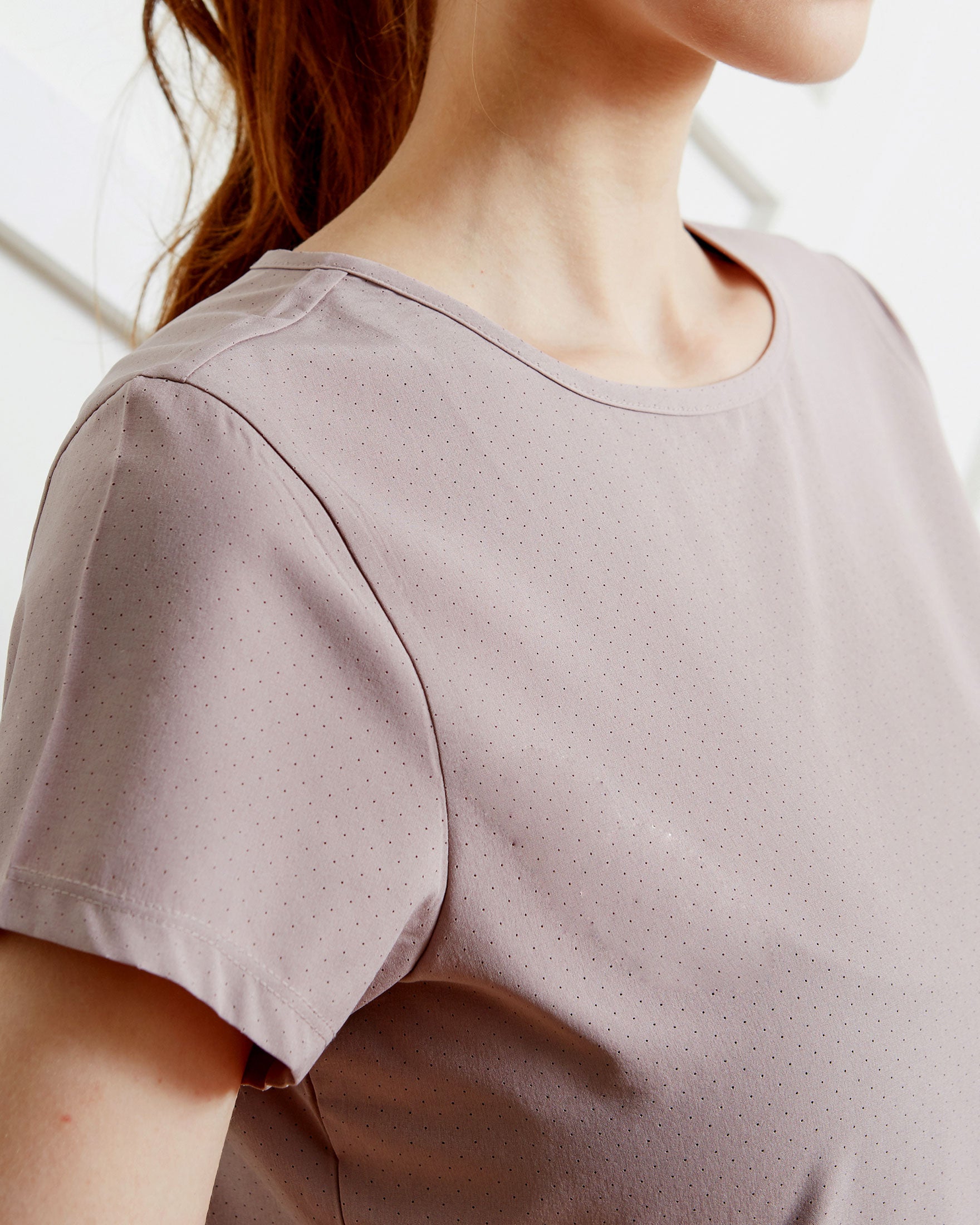 Airy Mile Laser Cut Mesh Top featuring breathable mesh design and short sleeves, ideal for workouts and hot weather.