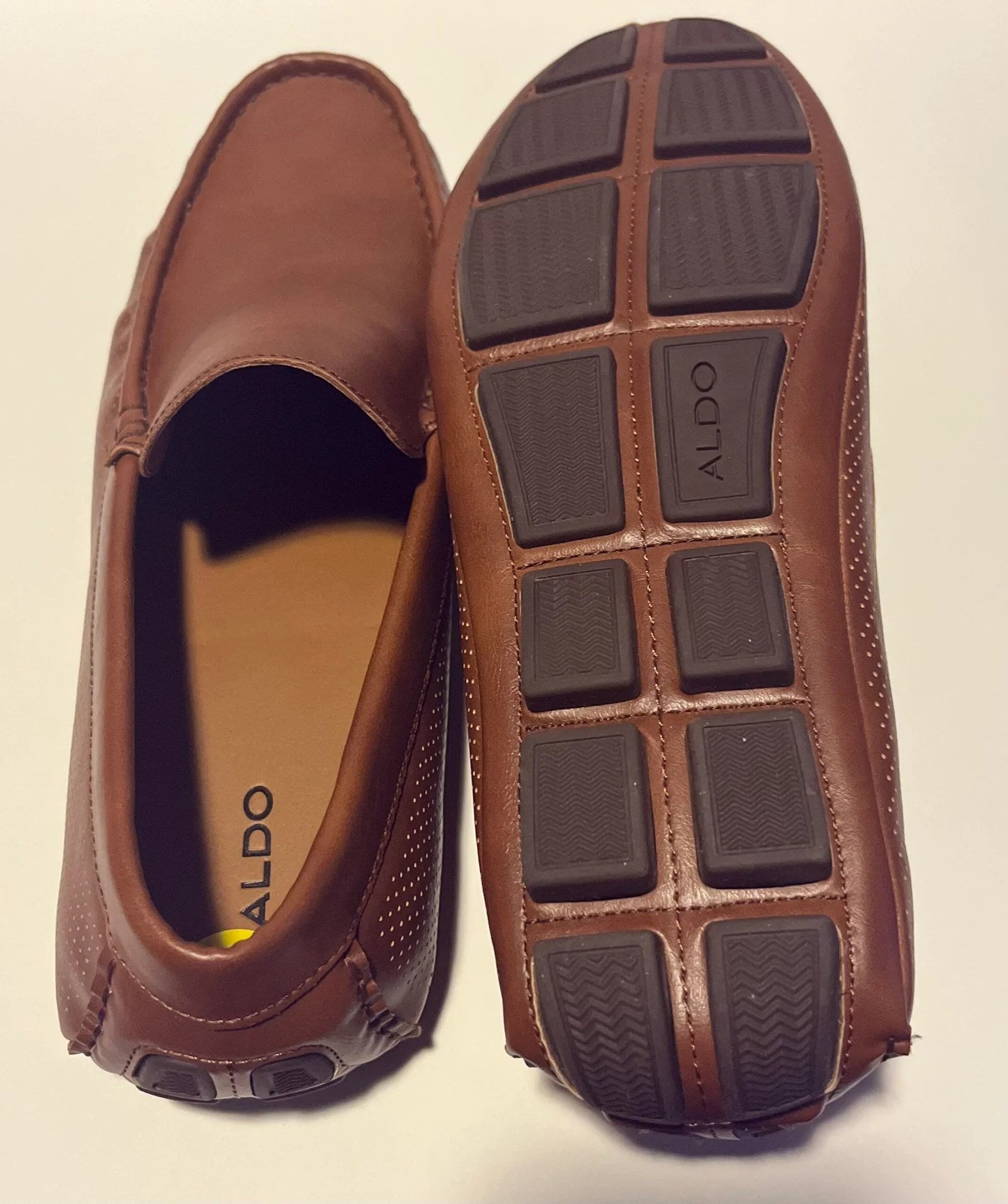 A pair of stylish Aldo Comfortable Men's Loafers made from genuine leather, featuring a moc toe design and cushioned insole.