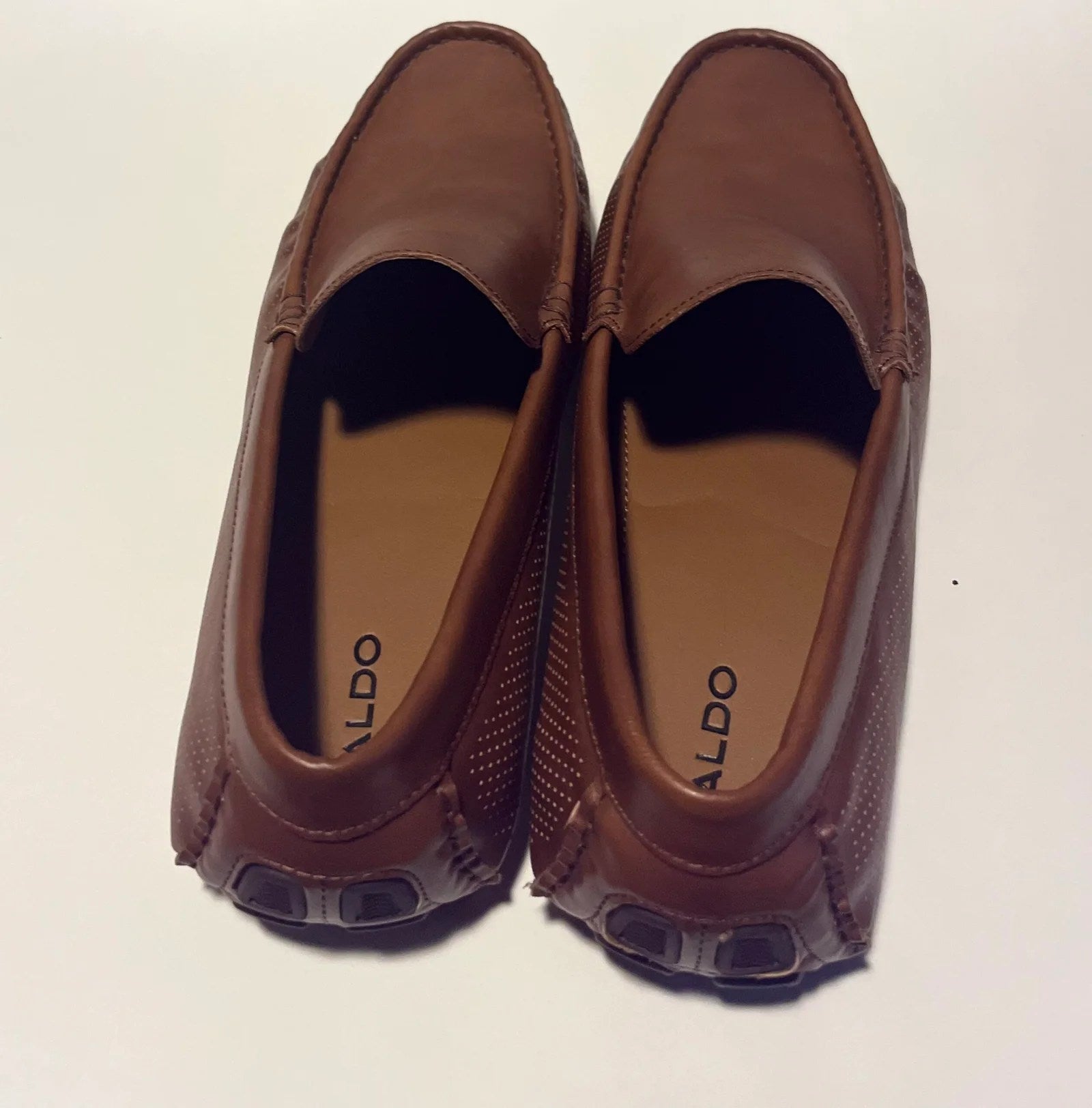 A pair of stylish Aldo Comfortable Men's Loafers made from genuine leather, featuring a moc toe design and cushioned insole.