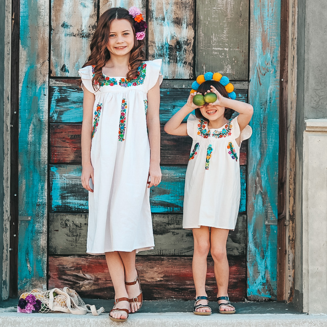 Allegra Sundress featuring flutter sleeves and multicolor hand embroidery on organic cotton fabric.