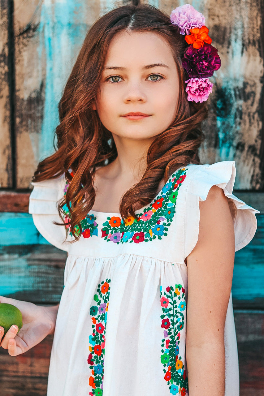 Allegra Sundress featuring flutter sleeves and multicolor hand embroidery on organic cotton fabric.