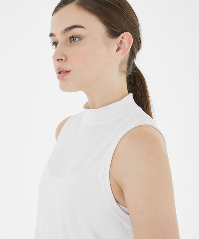 Allegro Tank featuring a stylish half-neck design and unbalanced length for body line concealment.