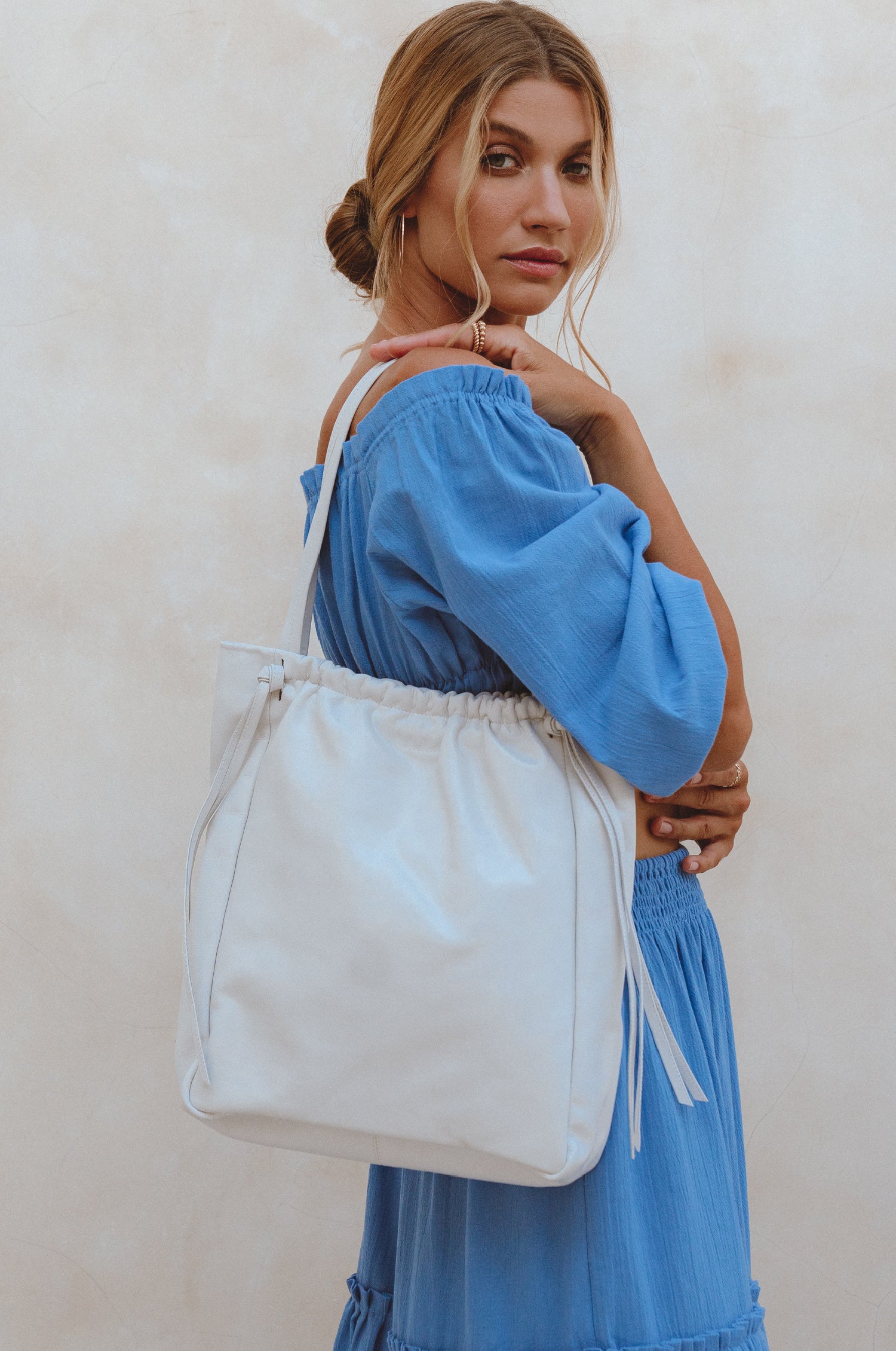 Alessia Leather Tote Bag featuring ruched detailing and tassels, handcrafted from genuine leather, perfect for daily essentials.