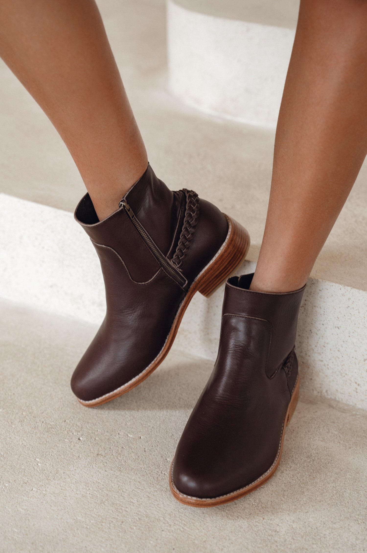 Alexa Ankle Leather Boots featuring a Chelsea silhouette, braided accent, and side zipper for easy wear.