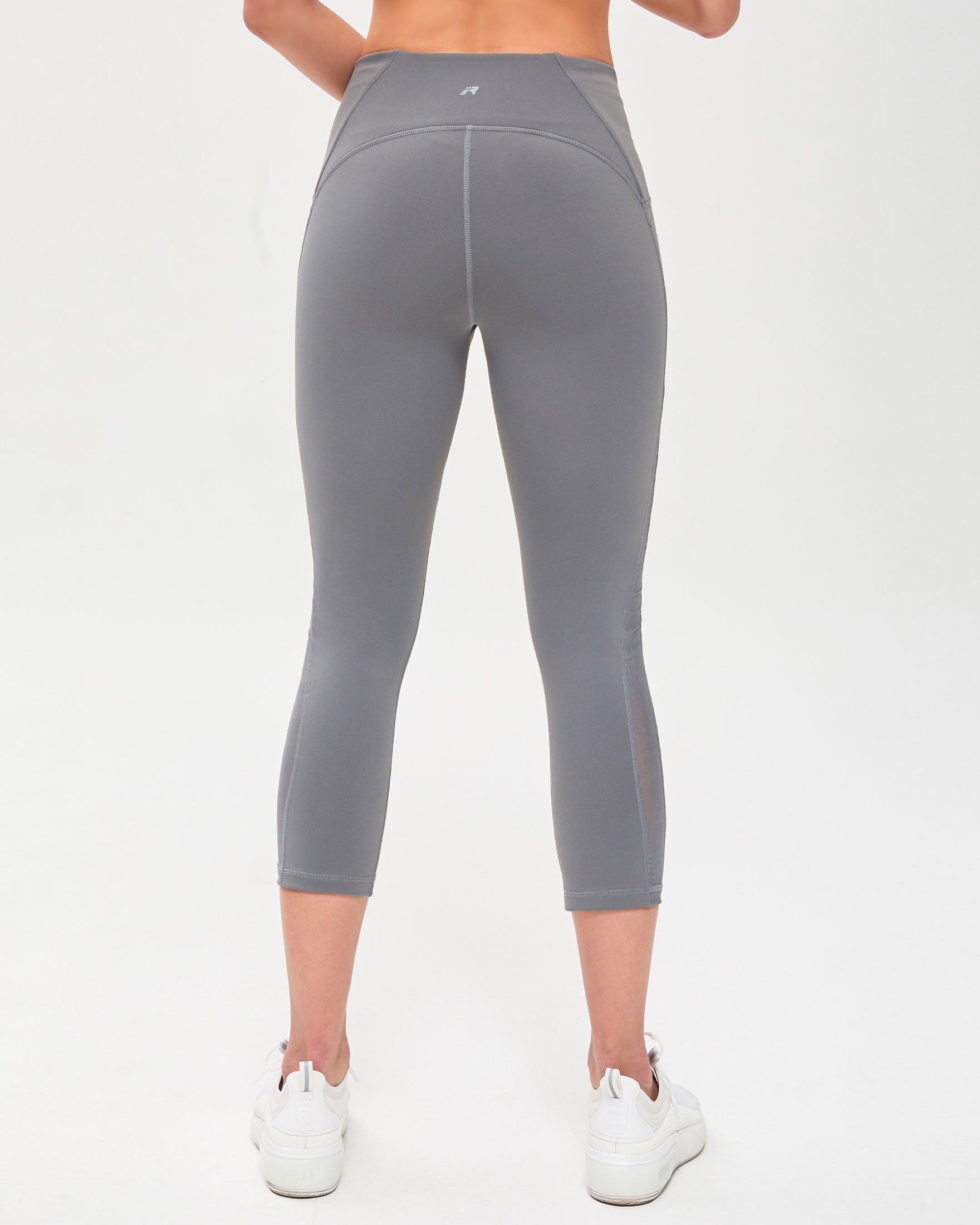 Alliance Ventiflo™ Crop Legging featuring mesh details, small pockets, and high compression fabric for optimal performance.