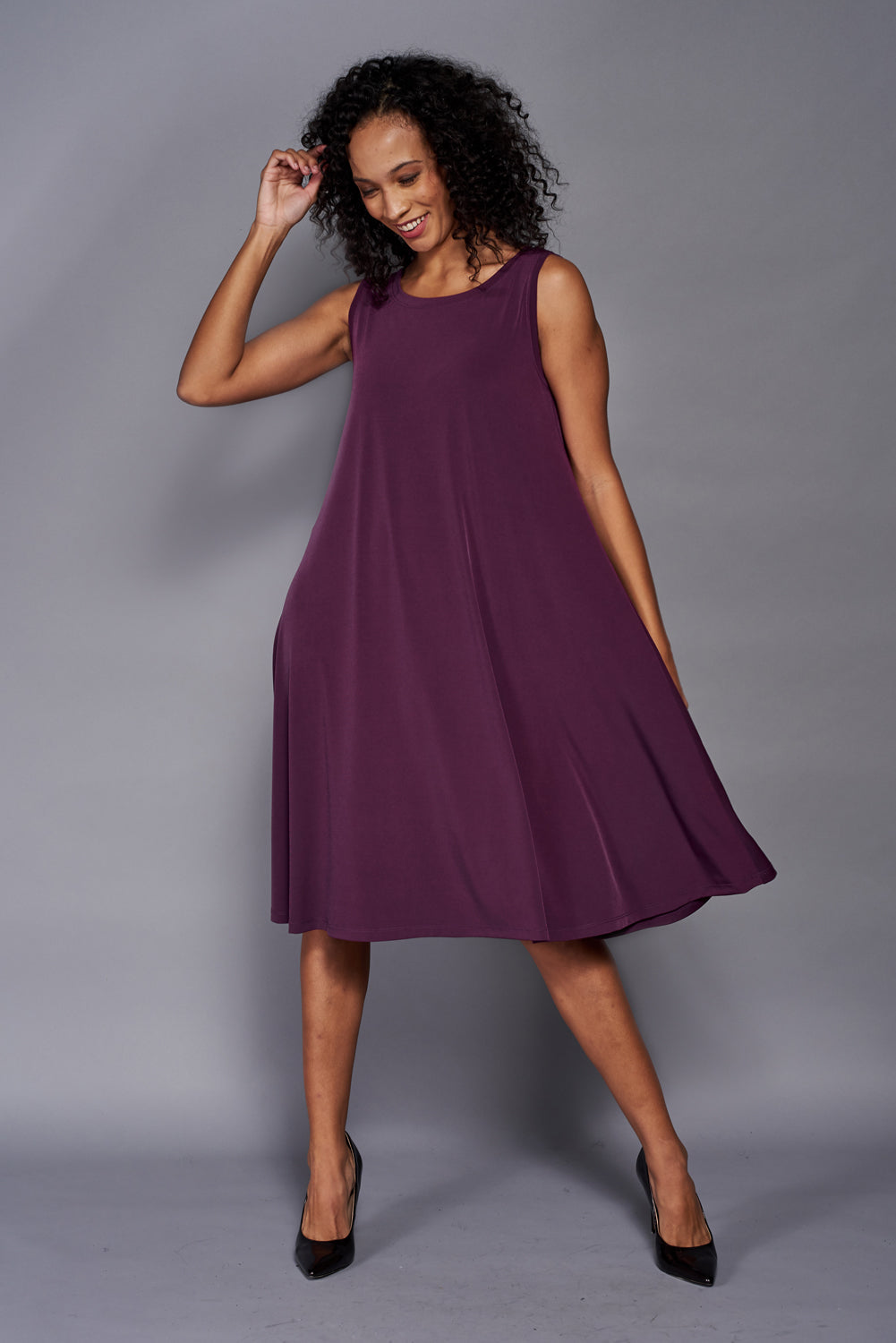 Aline Dress in midi length, showcasing soft stretch knit jersey fabric, perfect for layering.