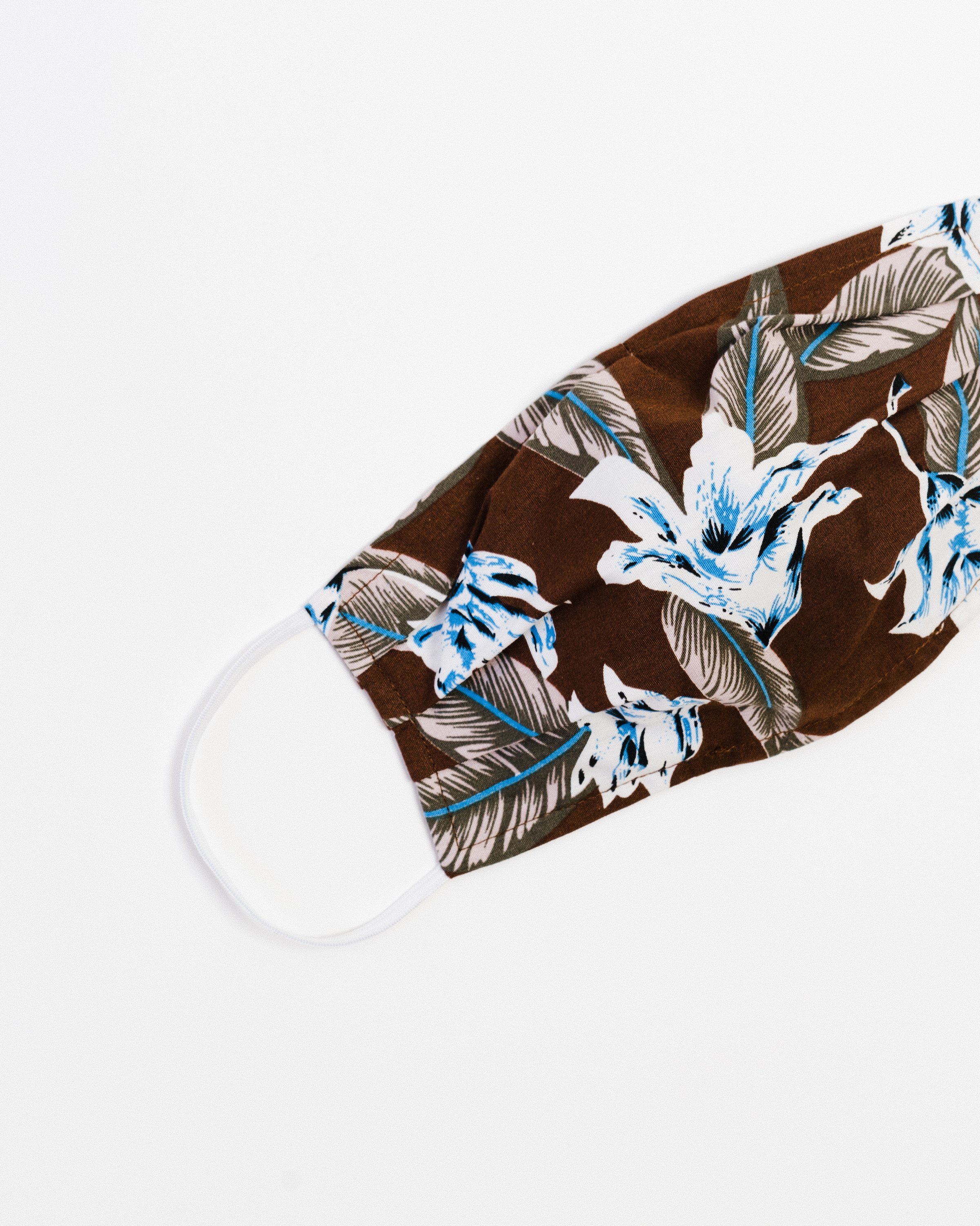 Aloha Face Mask made of breathable cotton with colorful prints, featuring pleats for comfort and a pocket for filters.