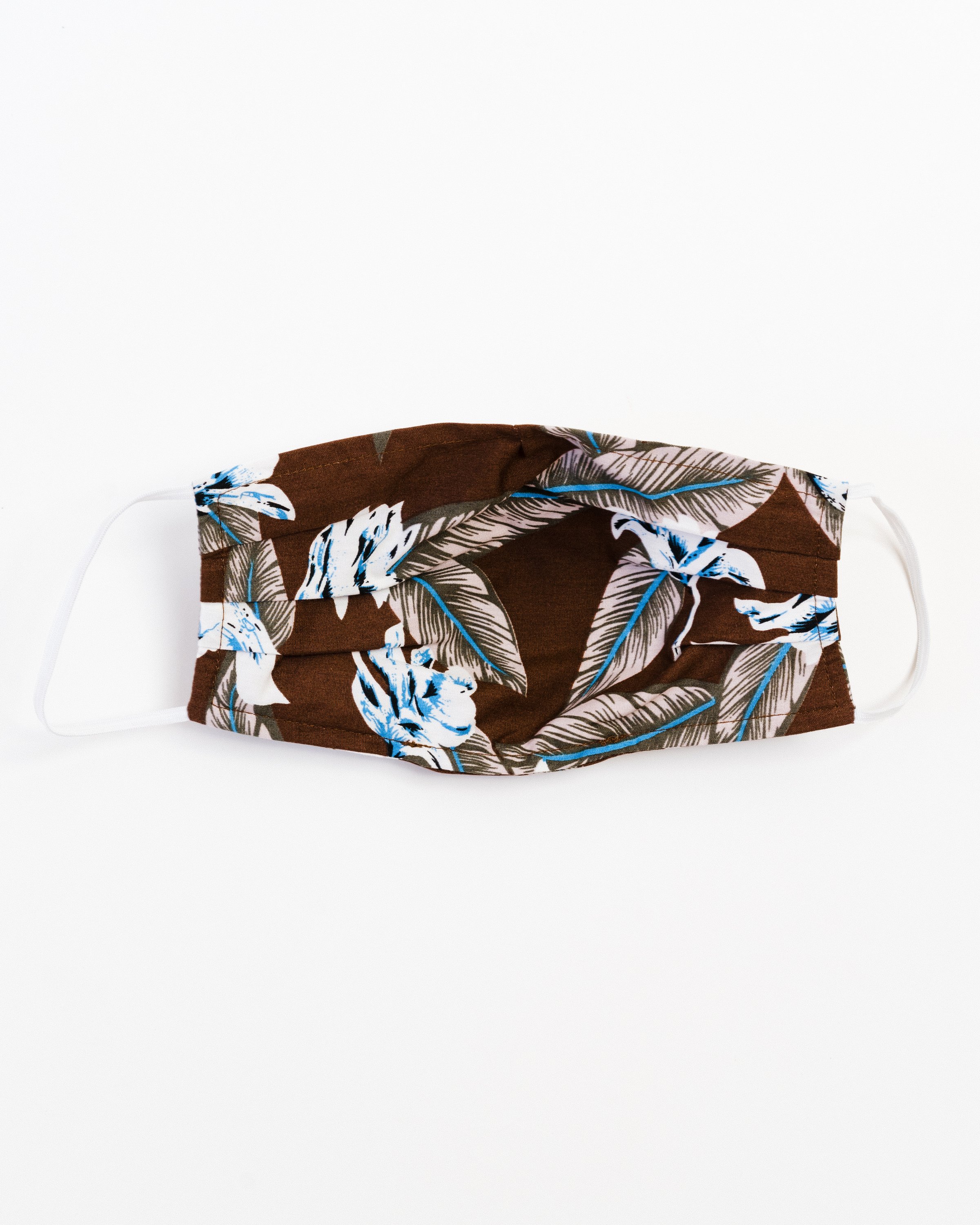 Aloha Face Mask made of breathable cotton with colorful prints, featuring pleats for comfort and a pocket for filters.