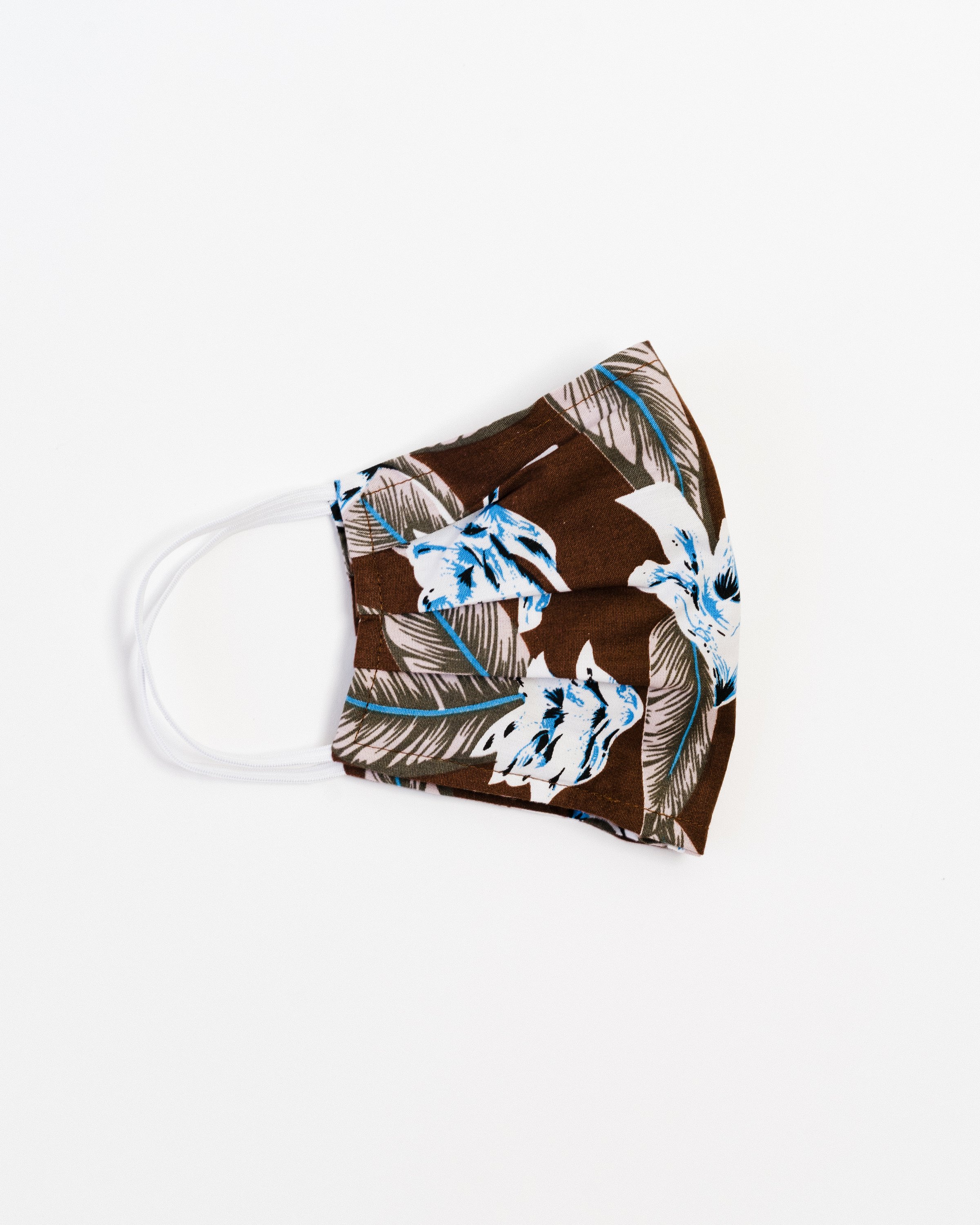 Aloha Face Mask made of breathable cotton with colorful prints, featuring pleats for comfort and a pocket for filters.