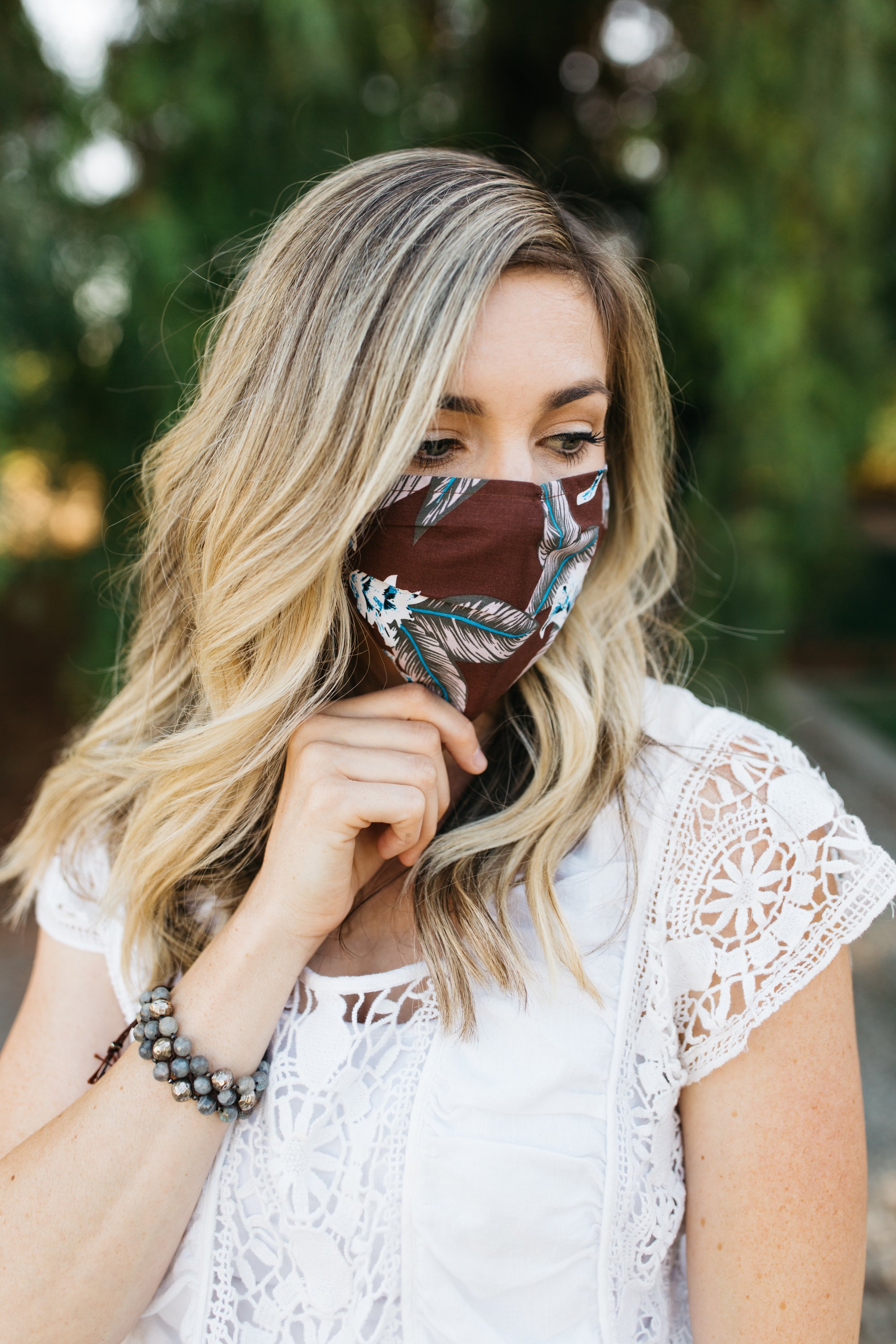 Aloha Face Mask made of breathable cotton with colorful prints, featuring pleats for comfort and a pocket for filters.