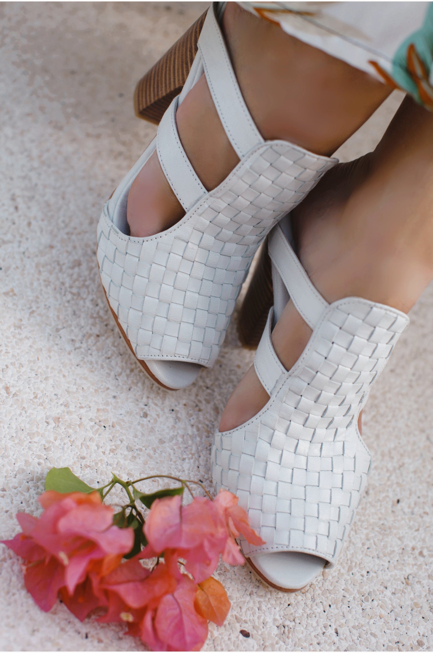 Amane Woven Mules Heels showcasing intricate woven design and chunky wooden heel, perfect for stylish outings.