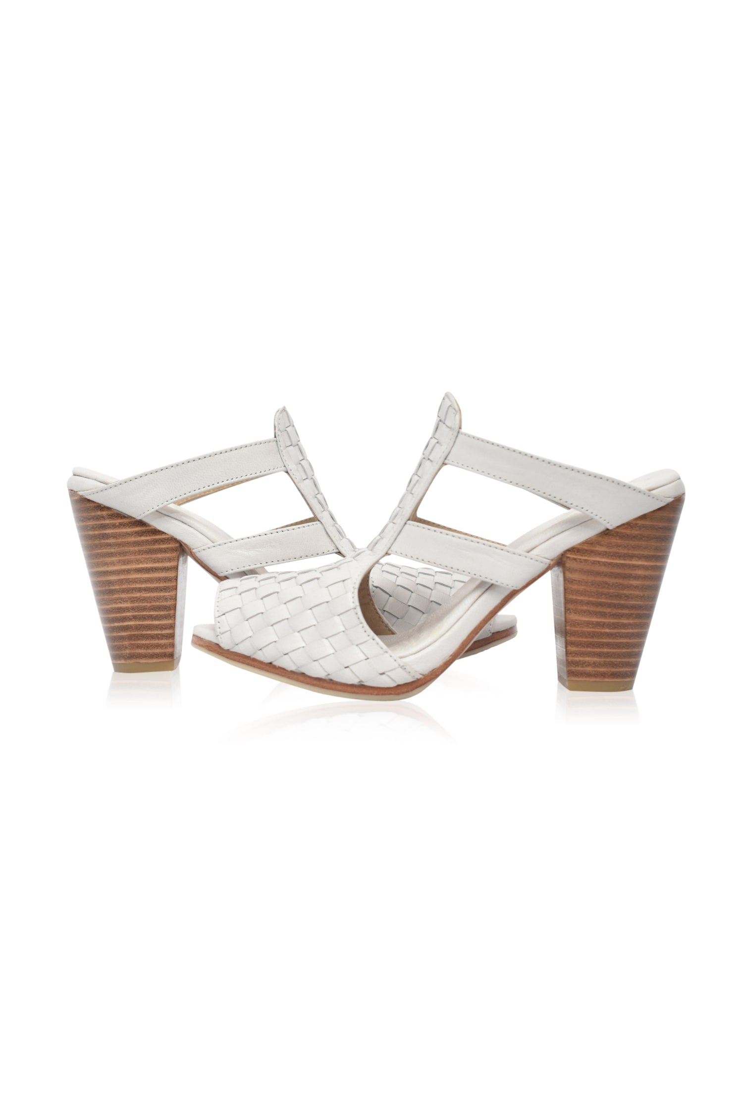 Amane Woven Mules Heels showcasing intricate woven design and chunky wooden heel, perfect for stylish outings.