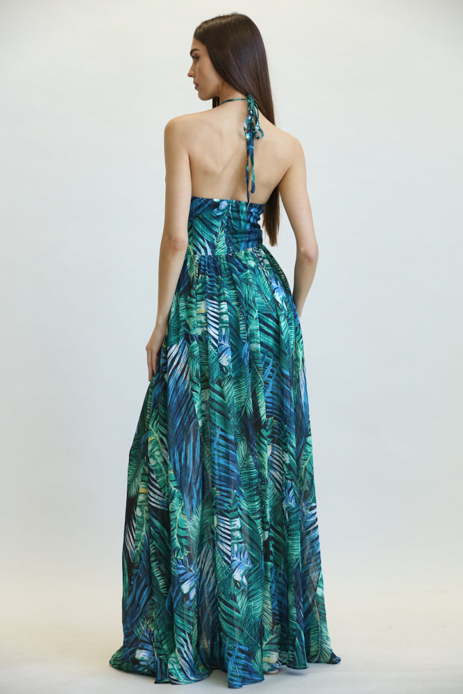 Amata Jungle Leaf Print Pattern Dress featuring a halter neckline, multi-cutout bodice, and A-line maxi skirt with a front leg slit.