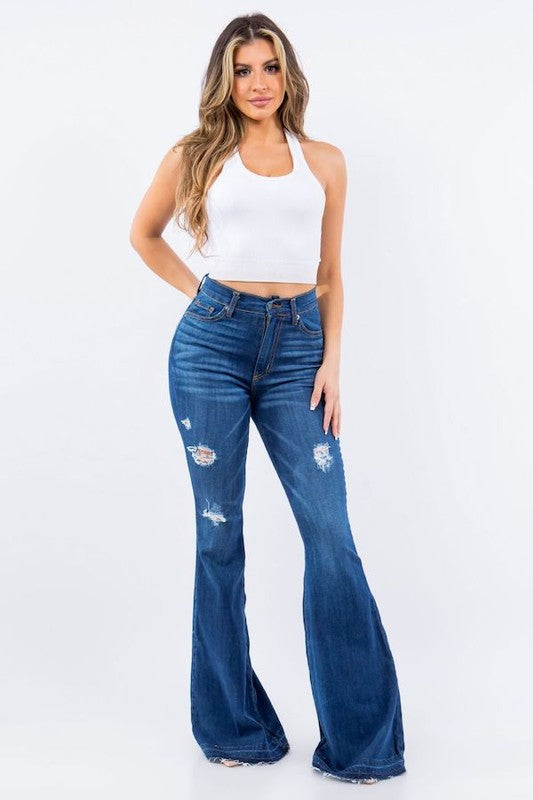 Amber Bell Bottom Jean featuring ripped details and unfinished hem, high-rise fit with pockets.