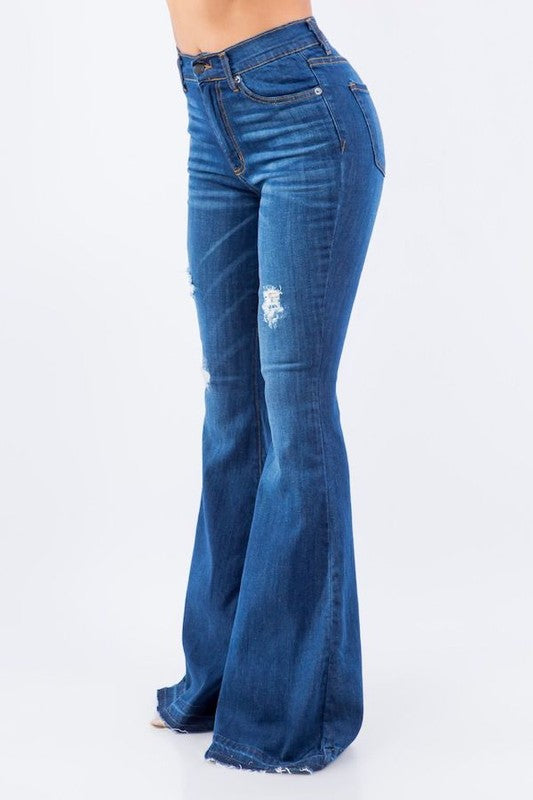 Amber Bell Bottom Jean featuring ripped details and unfinished hem, high-rise fit with pockets.