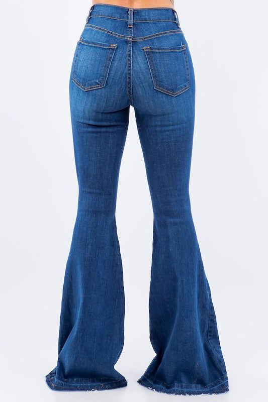 Amber Bell Bottom Jean featuring ripped details and unfinished hem, high-rise fit with pockets.