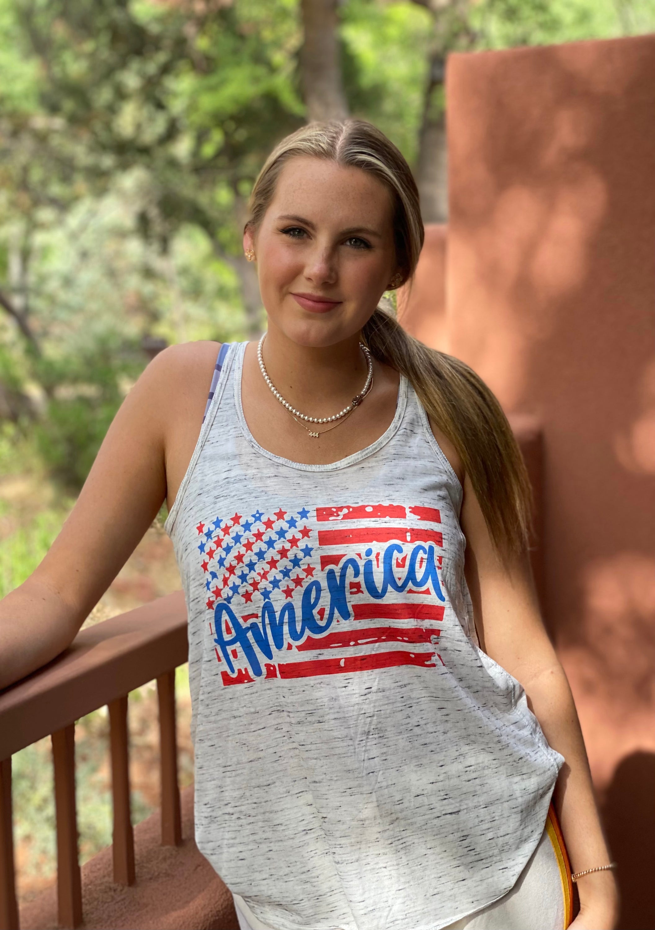 America Flowy Tank featuring a bold American flag design, loose fit, and soft fabric, perfect for summer wear.