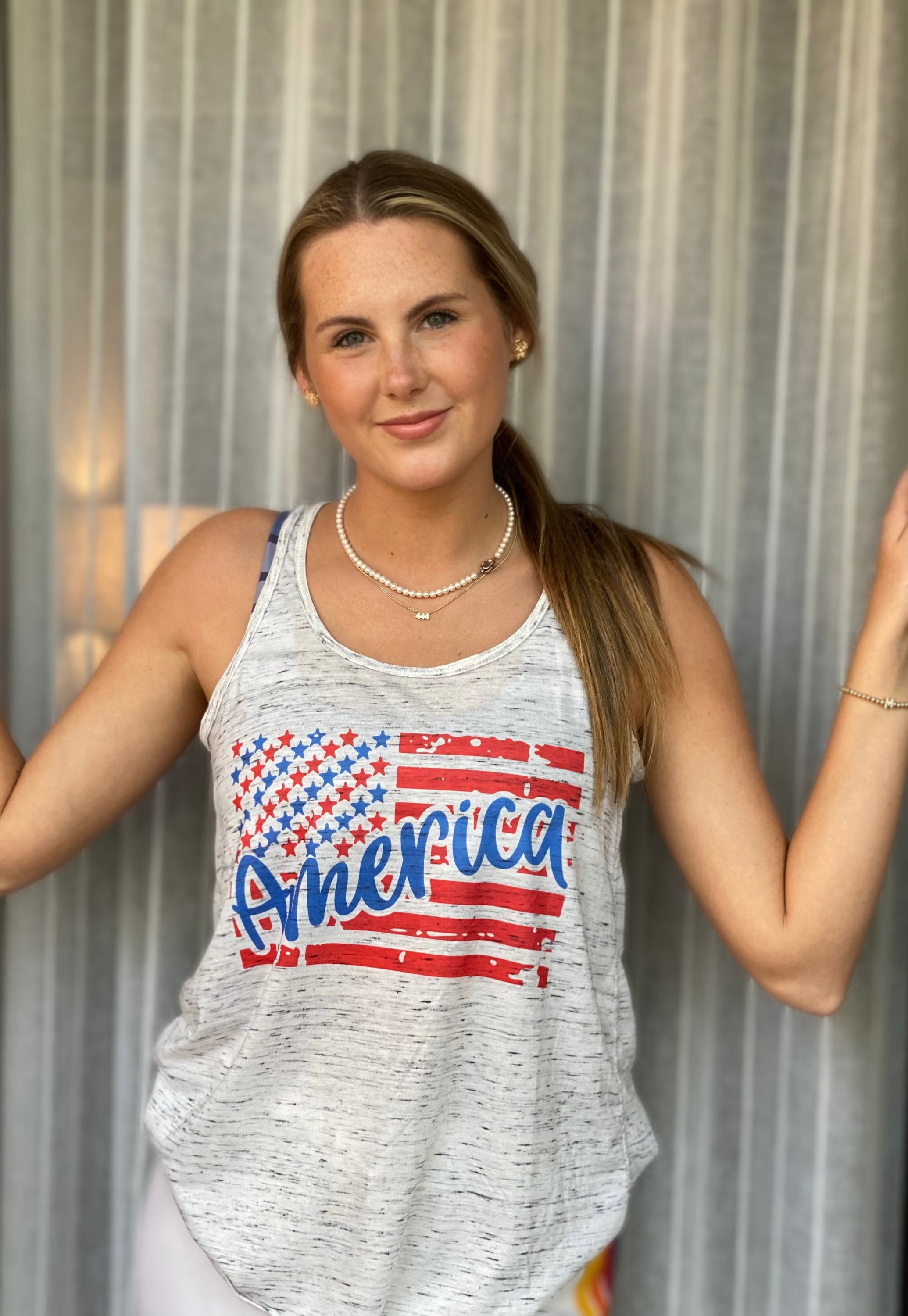 America Flowy Tank featuring a bold American flag design, loose fit, and soft fabric, perfect for summer wear.