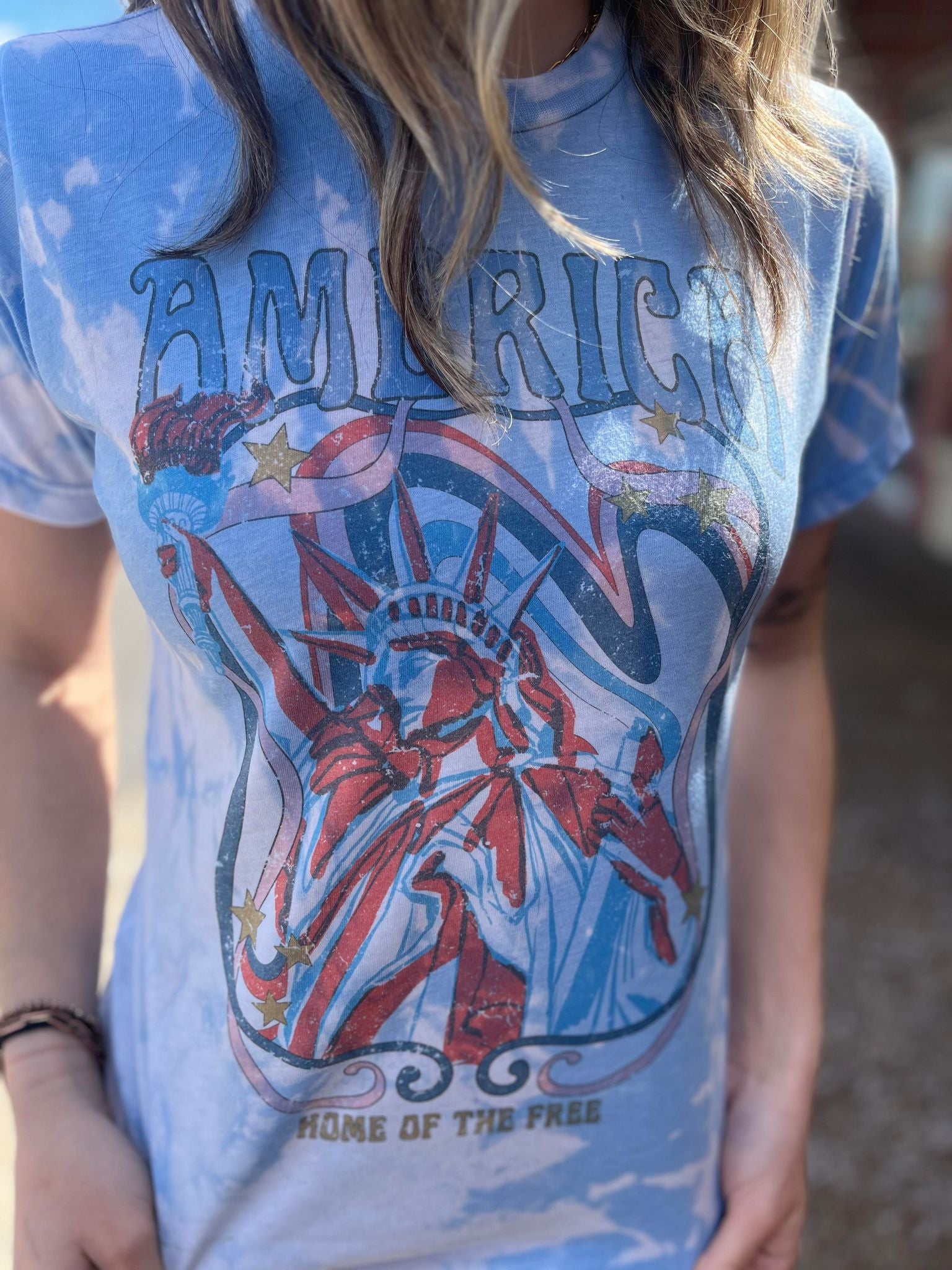 America Home Of The Free Bleach Tee featuring a unique hand-bleached design, perfect for patriotic celebrations.