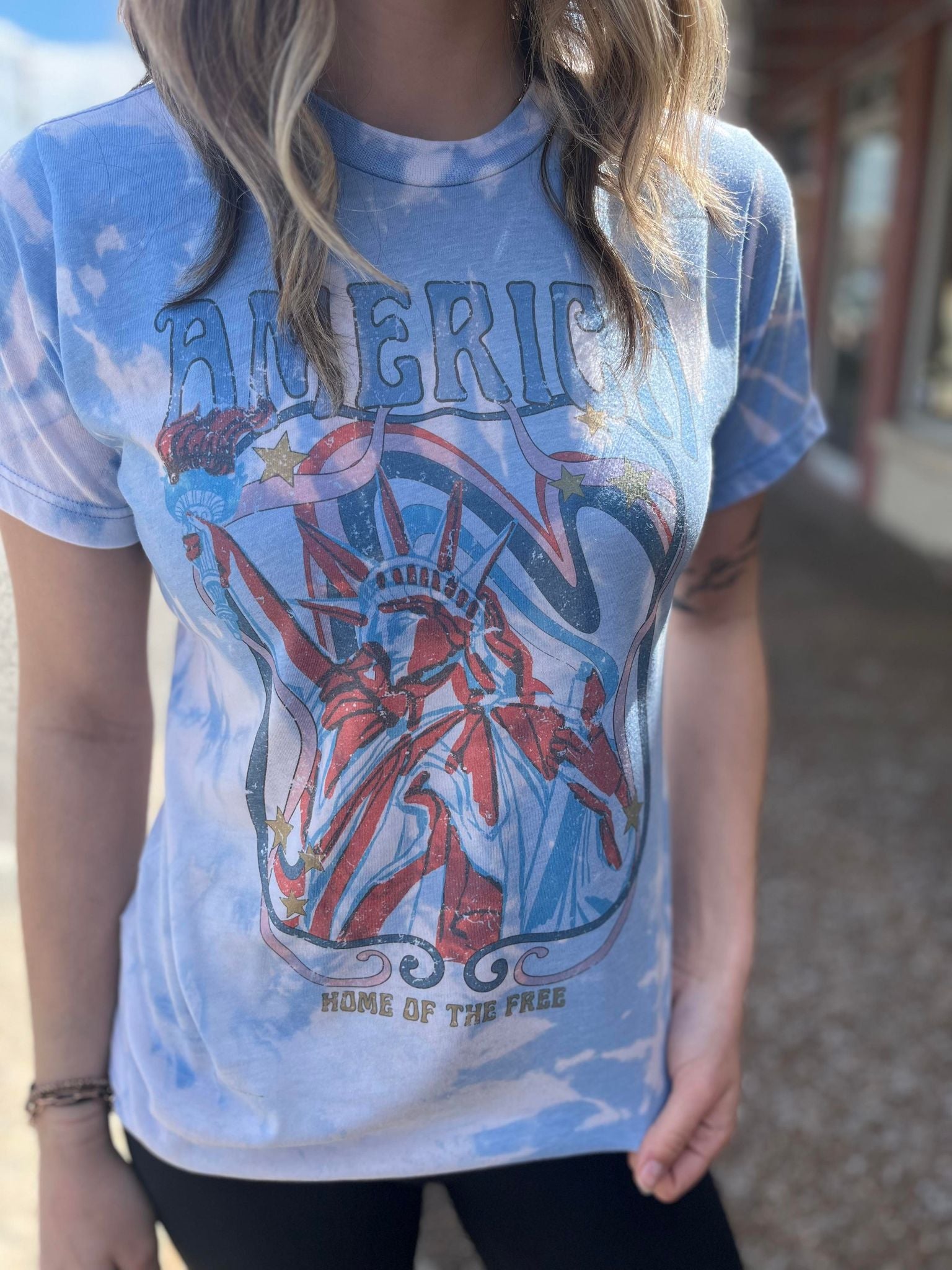 America Home Of The Free Bleach Tee featuring a unique hand-bleached design, perfect for patriotic celebrations.