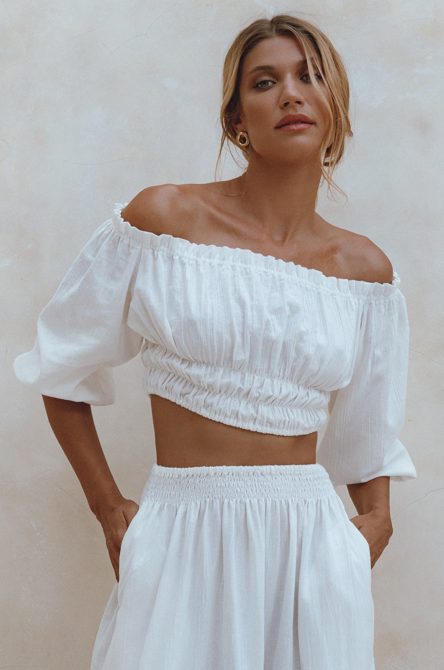 Annabelle Linen Cropped Top in crinkle linen with elasticated waist and sleeves, styled with a maxi skirt.