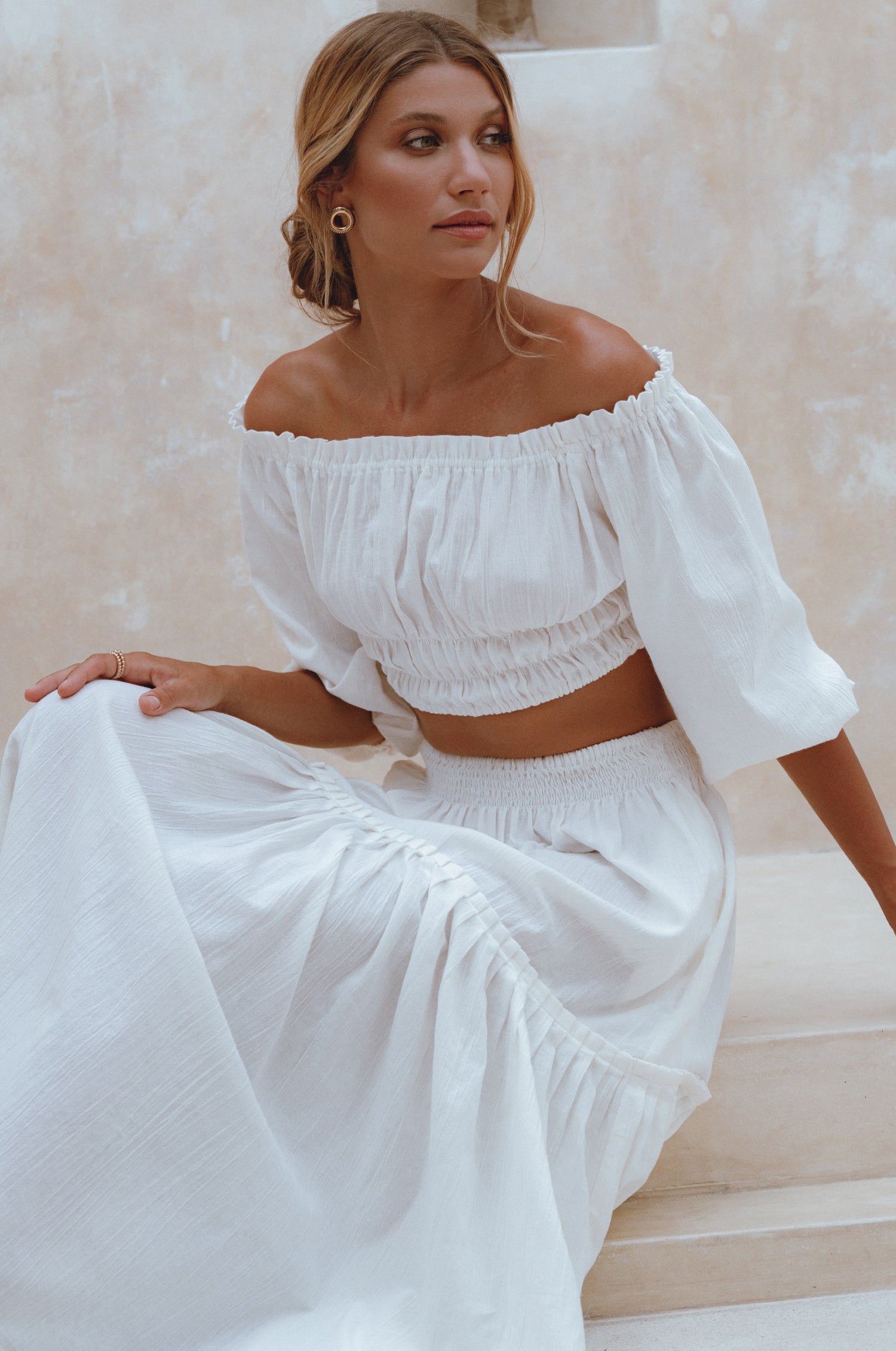 Annabelle Linen Cropped Top in crinkle linen with elasticated waist and sleeves, styled with a maxi skirt.