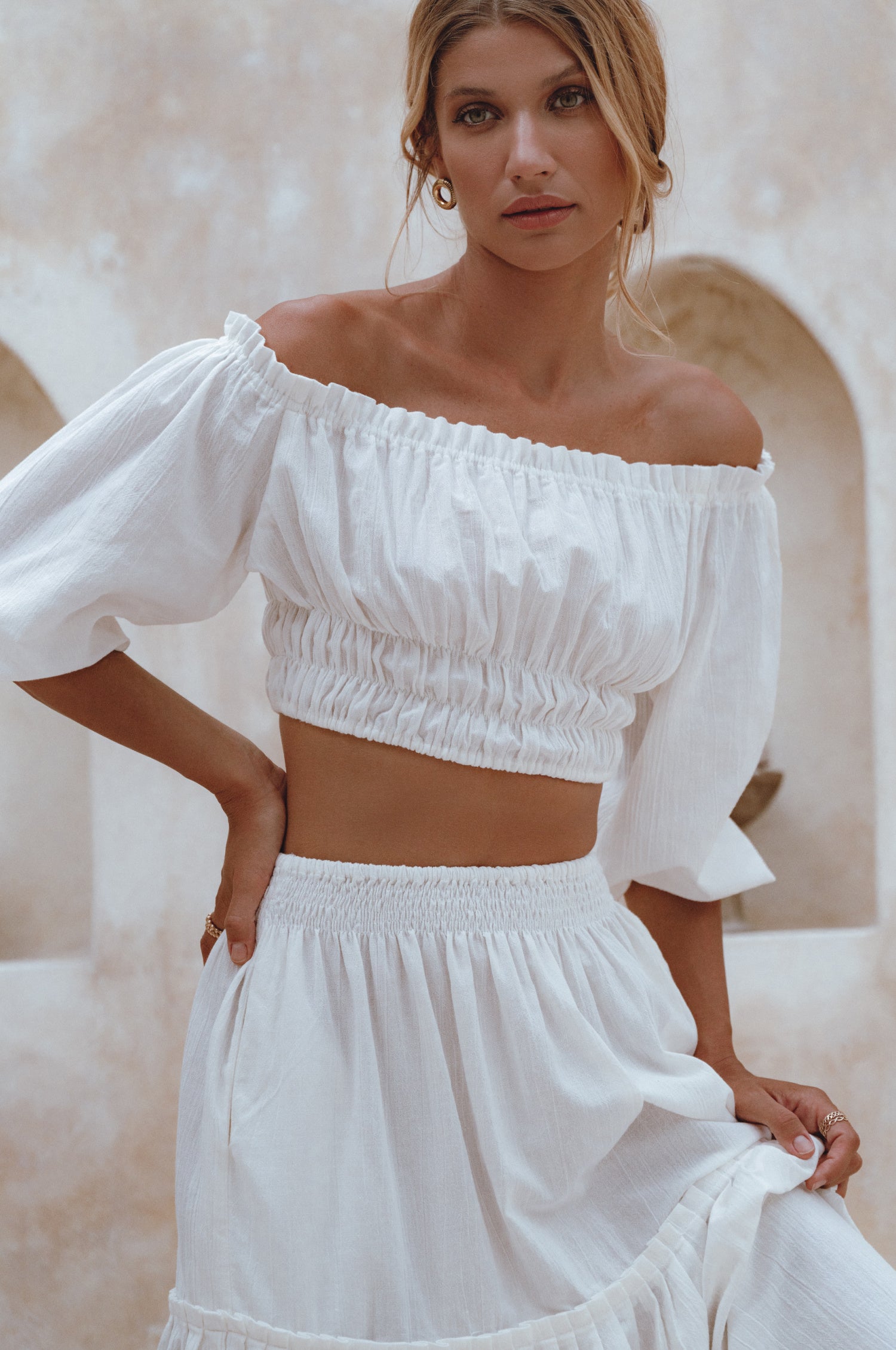 Annabelle Linen Cropped Top in crinkle linen with elasticated waist and sleeves, styled with a maxi skirt.