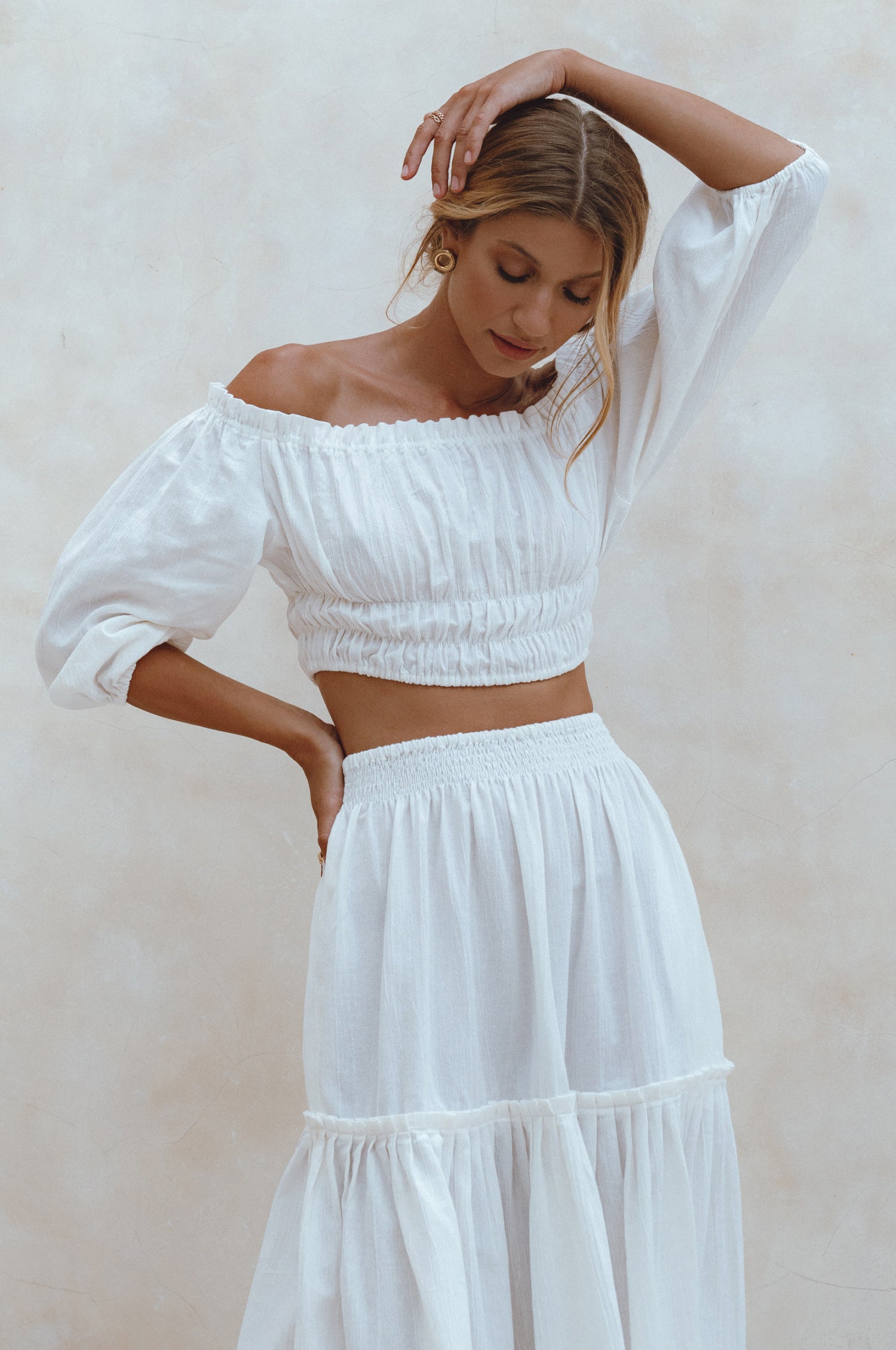 Annabelle Linen Cropped Top in crinkle linen with elasticated waist and sleeves, styled with a maxi skirt.