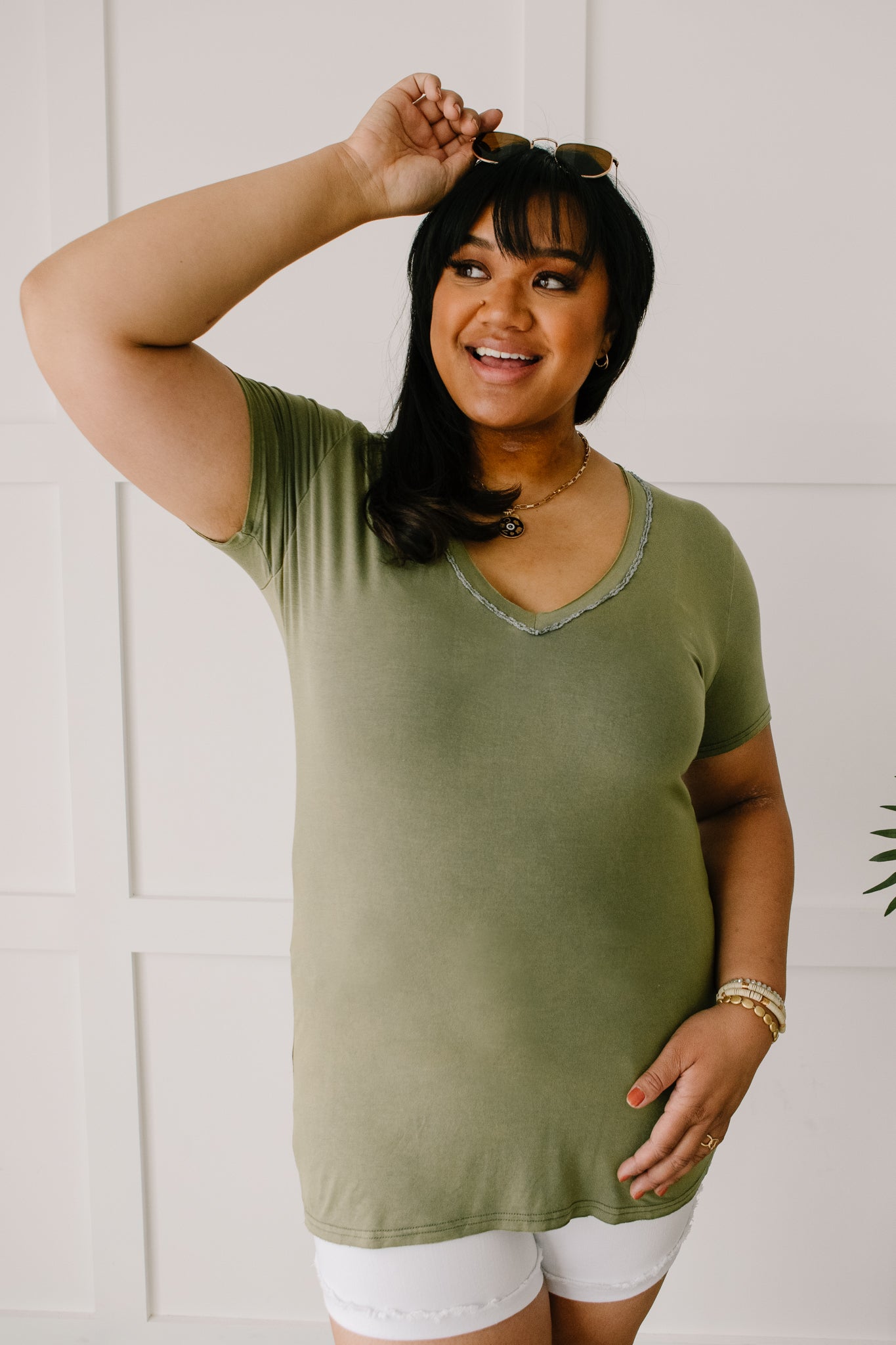 Andy Top in Olive featuring short sleeves and lace neckline detail, perfect for casual or dressy occasions.