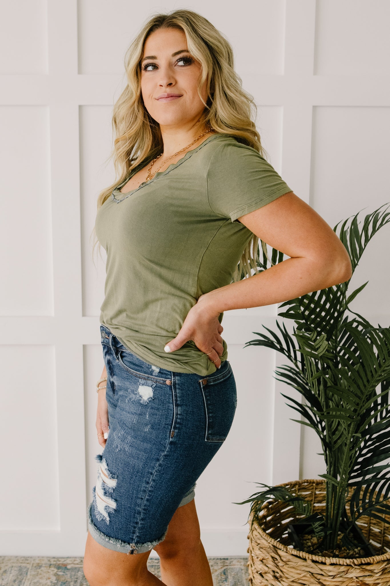 Andy Top in Olive featuring short sleeves and lace neckline detail, perfect for casual or dressy occasions.