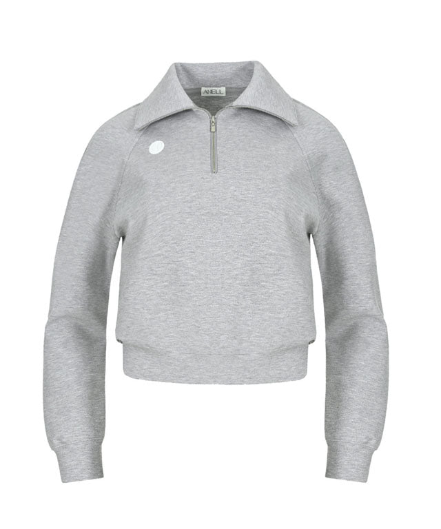 Anell Golf Airy Round Half Zip-Up in Melange Gray, showcasing its classic round detail and half zip design.