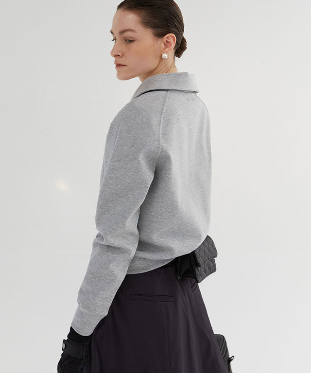 Anell Golf Airy Round Half Zip-Up in Melange Gray, showcasing its classic round detail and half zip design.